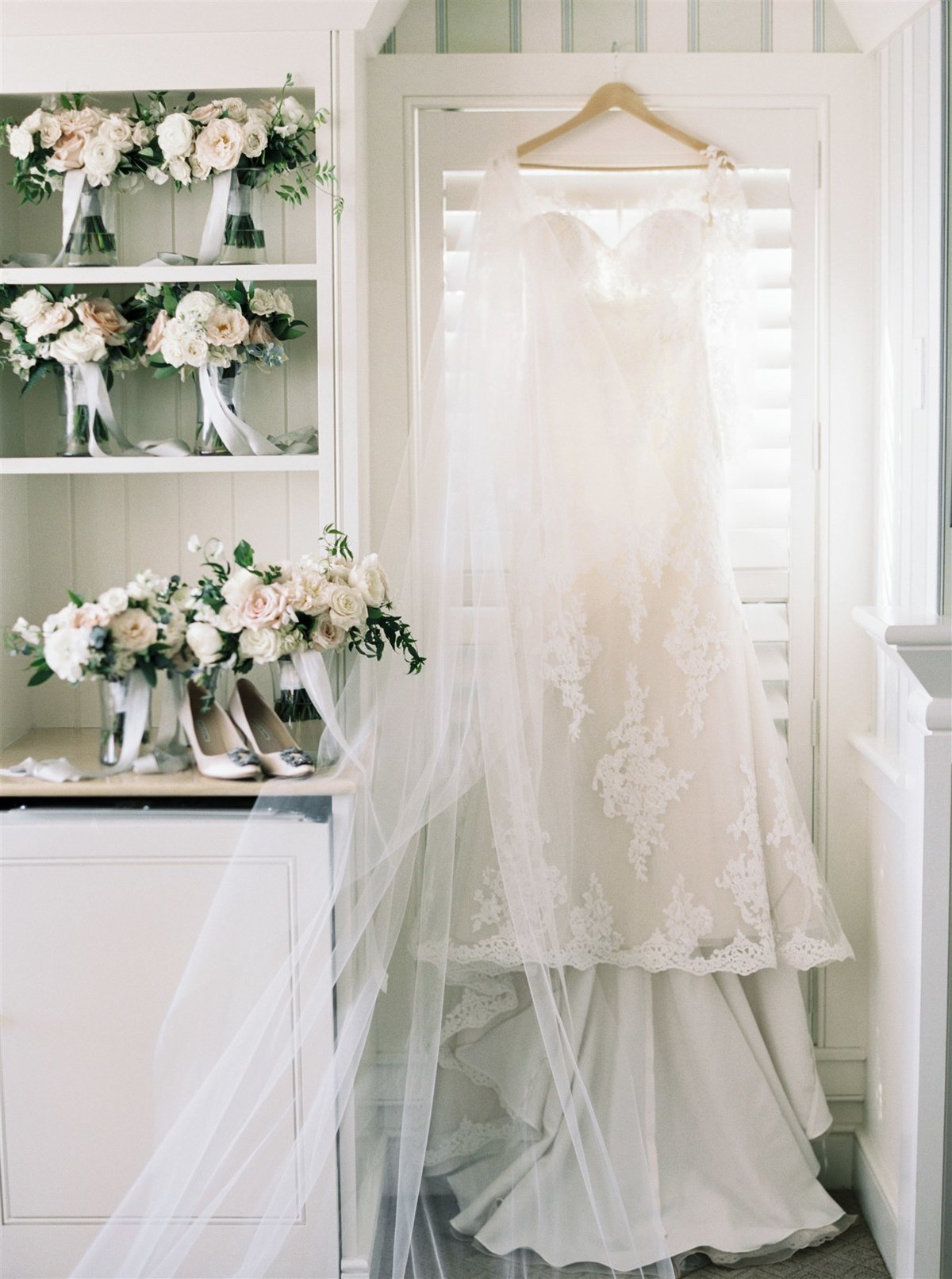 Pronovias gown with long sleeves and bouquets for a Cape Cod Wedding by luxury Cape Cod wedding planner and designer Always Yours Events