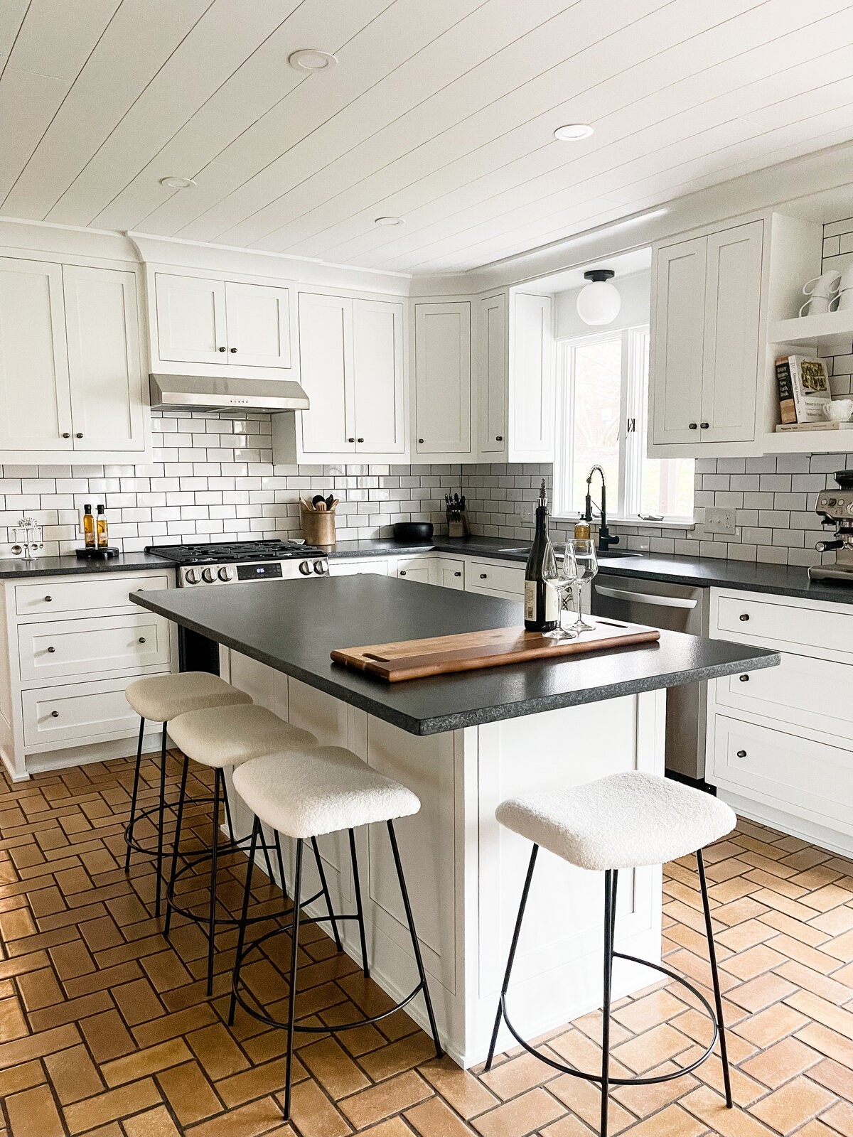 French kitchen, glazed tile, kitchen island, classic white kitchen, granite counters, subway tile, custom cabinetry