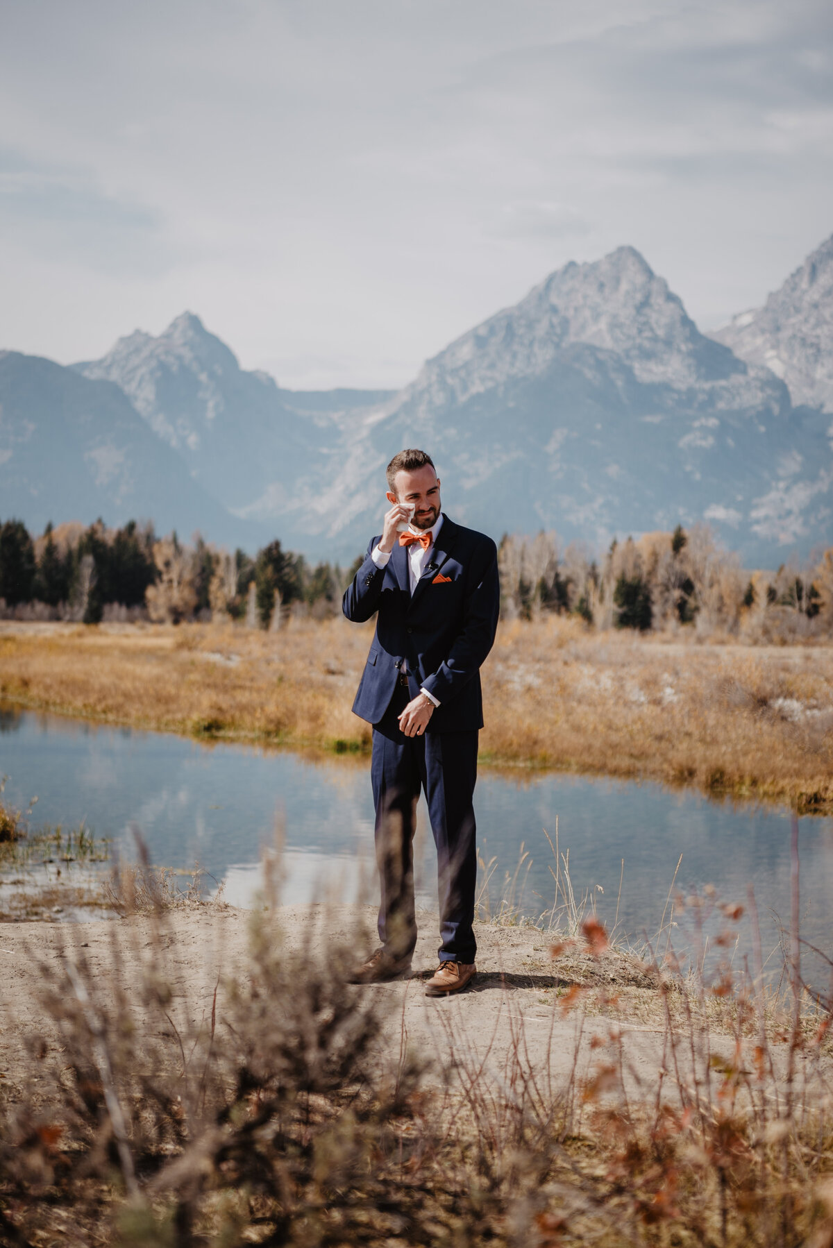 Photographers Jackson Hole capture groom waiting for bride before Grand Teton elopement