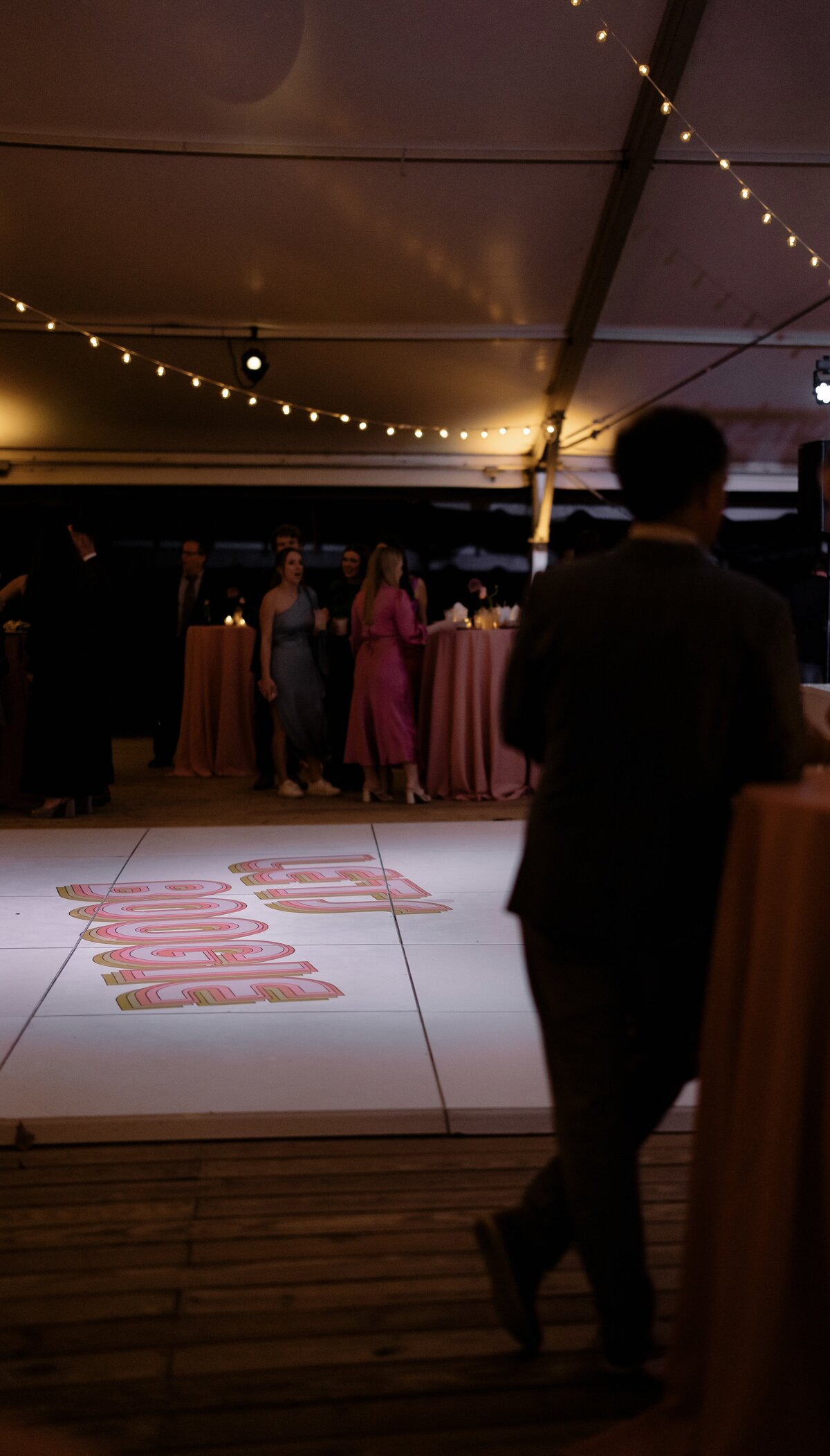 Wedding dance floor with Let's Boogie graphic on the floor