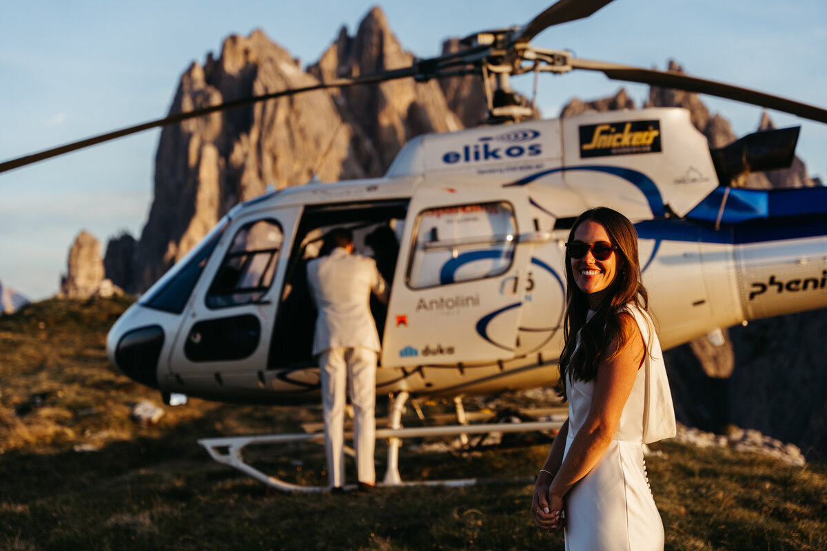 Helicopter flying over Dolomites peaks