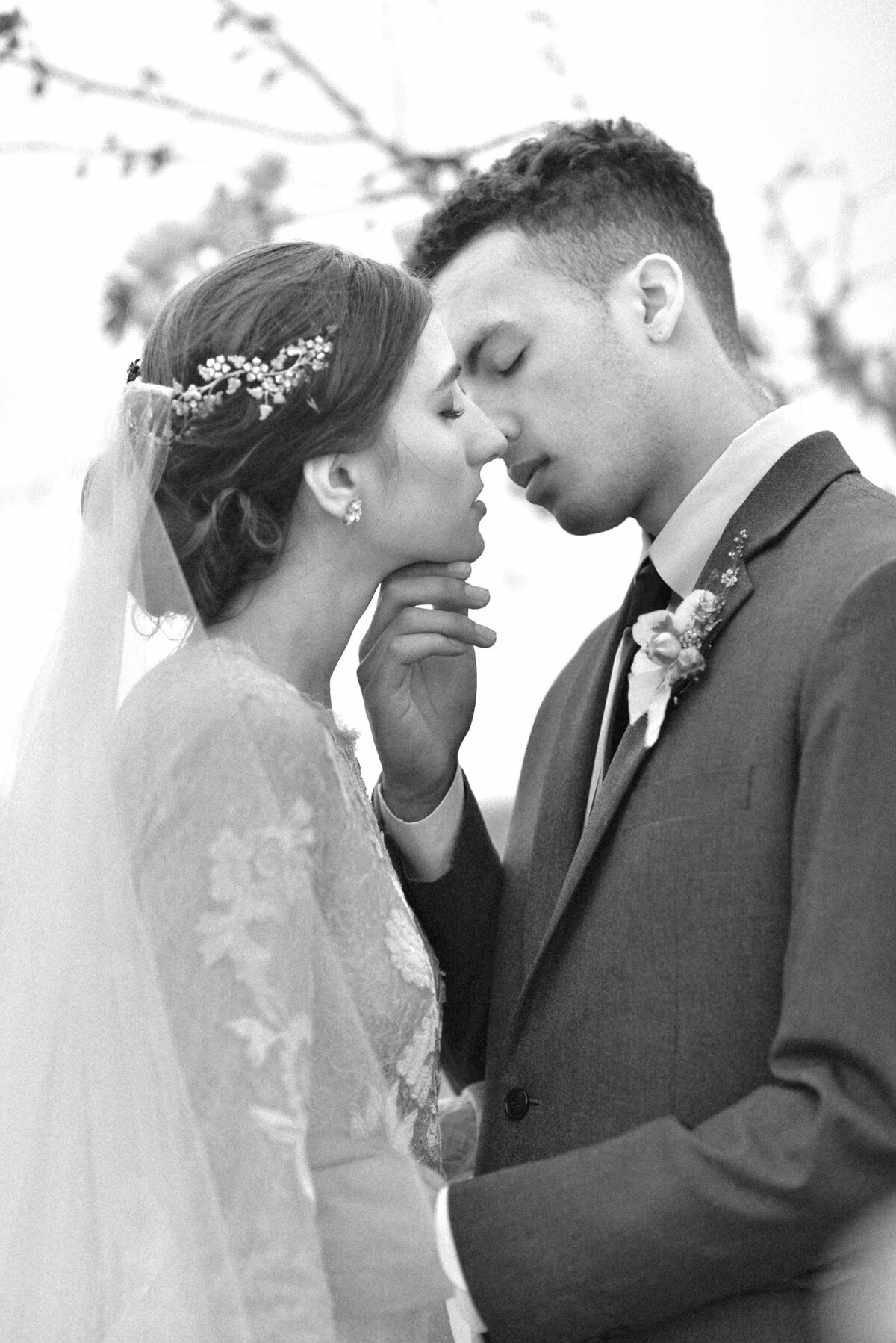 black and white image of couple kissing