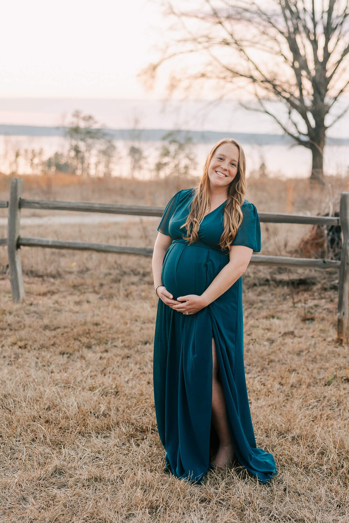 Augusta maternity photographer captured expecting mom as she walks through an open field.