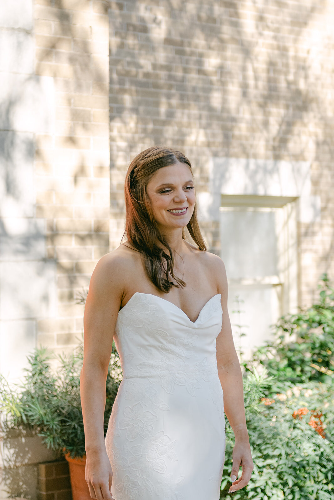 Soft bridal portrait surrounded by greenery with sunlit glow at luxury San Antonio wedding estate