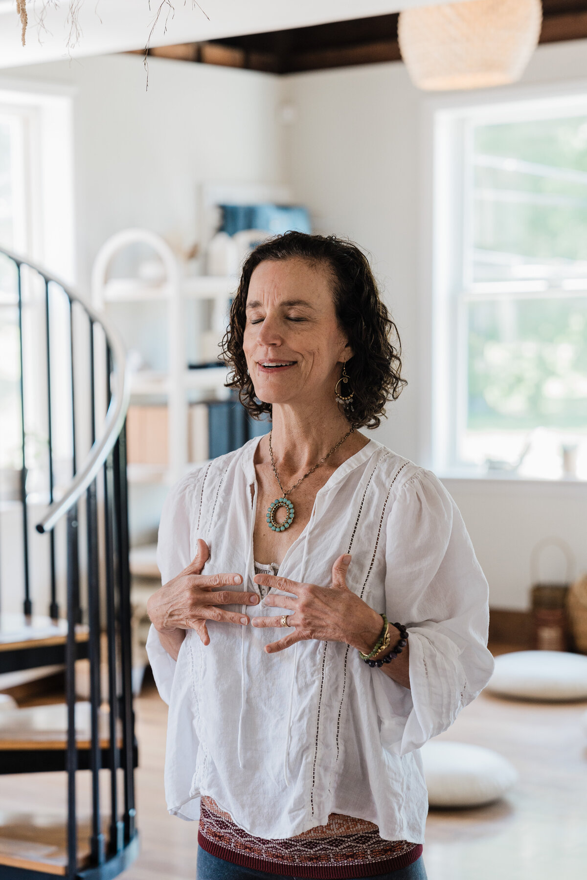 woman leads qigong class at Pause + Purpose