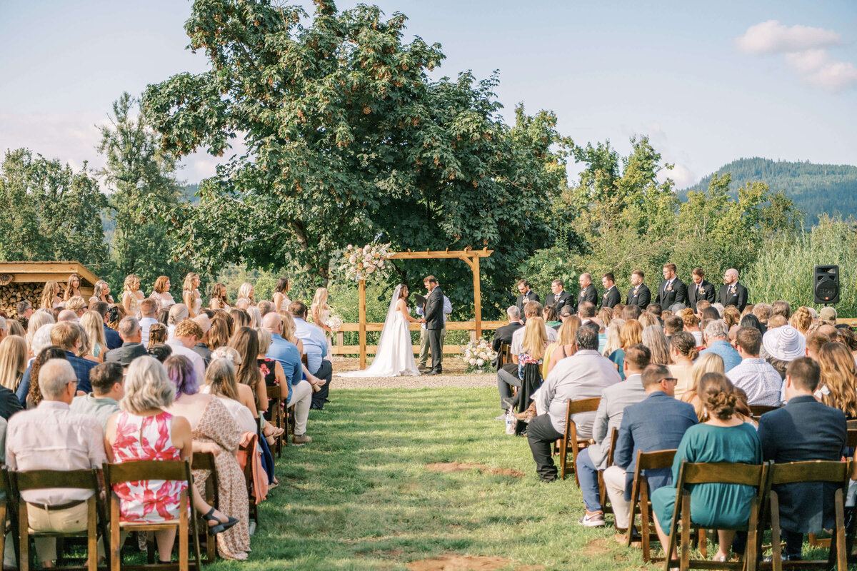 Outdoor wedding ceremony in Oregon planned by Birdie June Events.