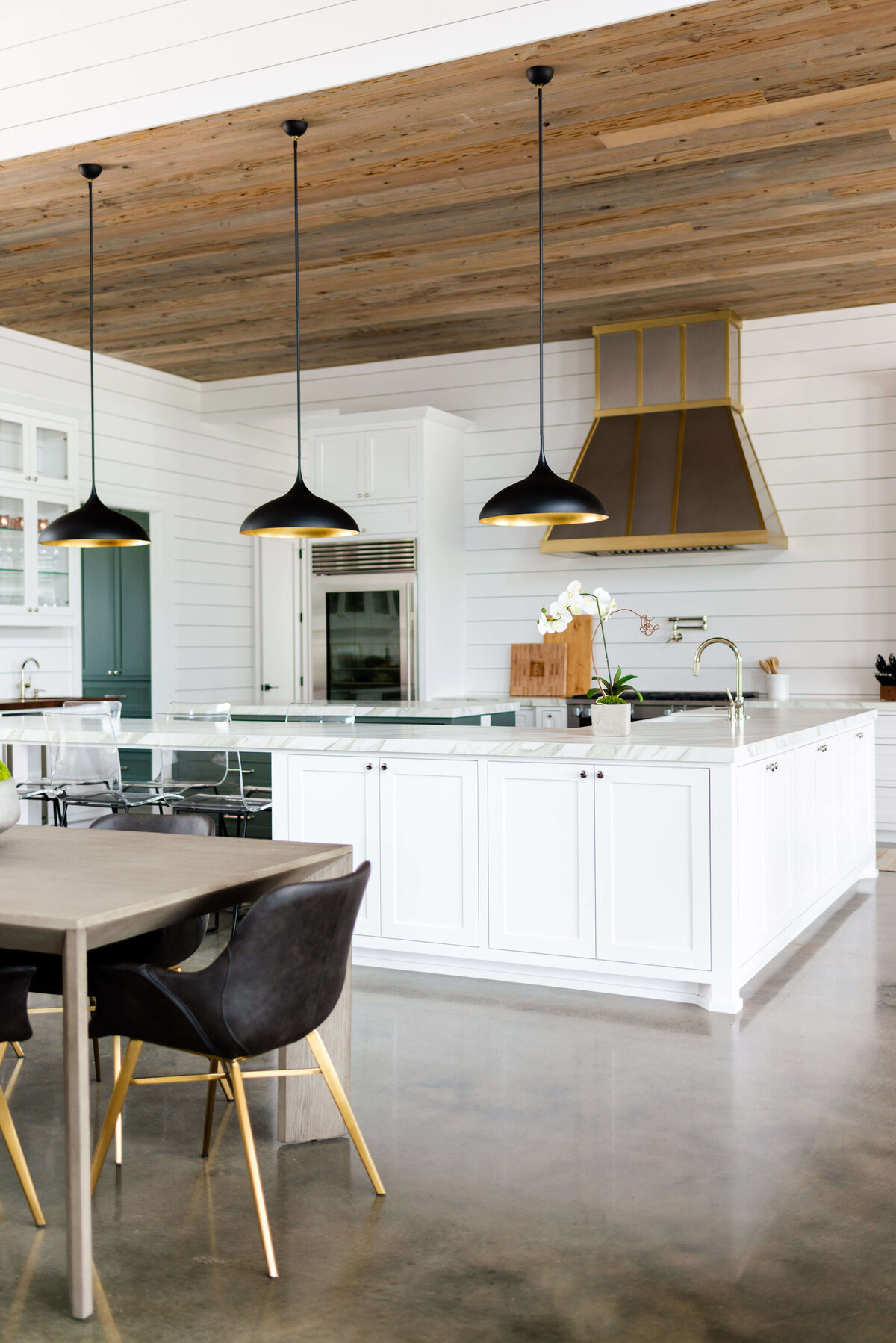oyster creek studios building belt new build white kitchen with shiplap ceiling and lighting