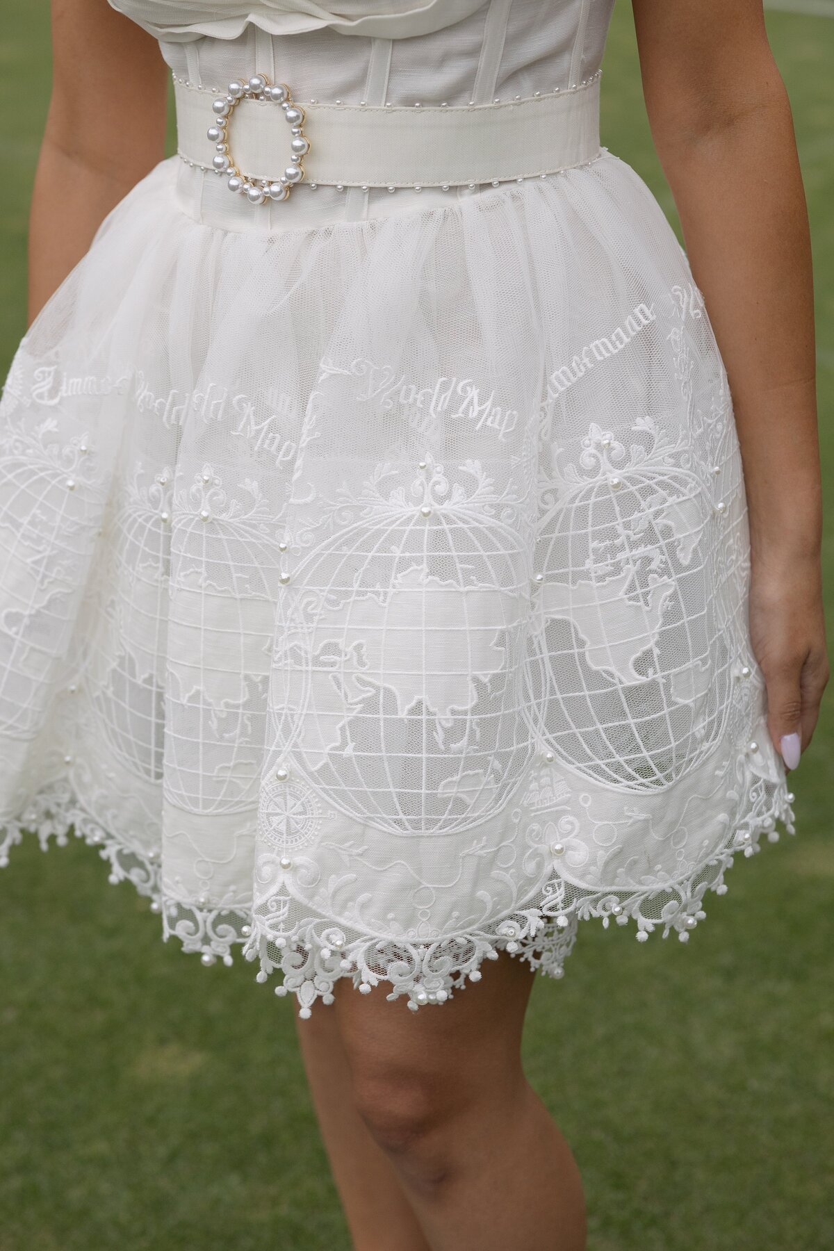 Close up embroidered details of a white Zimmerman dress.