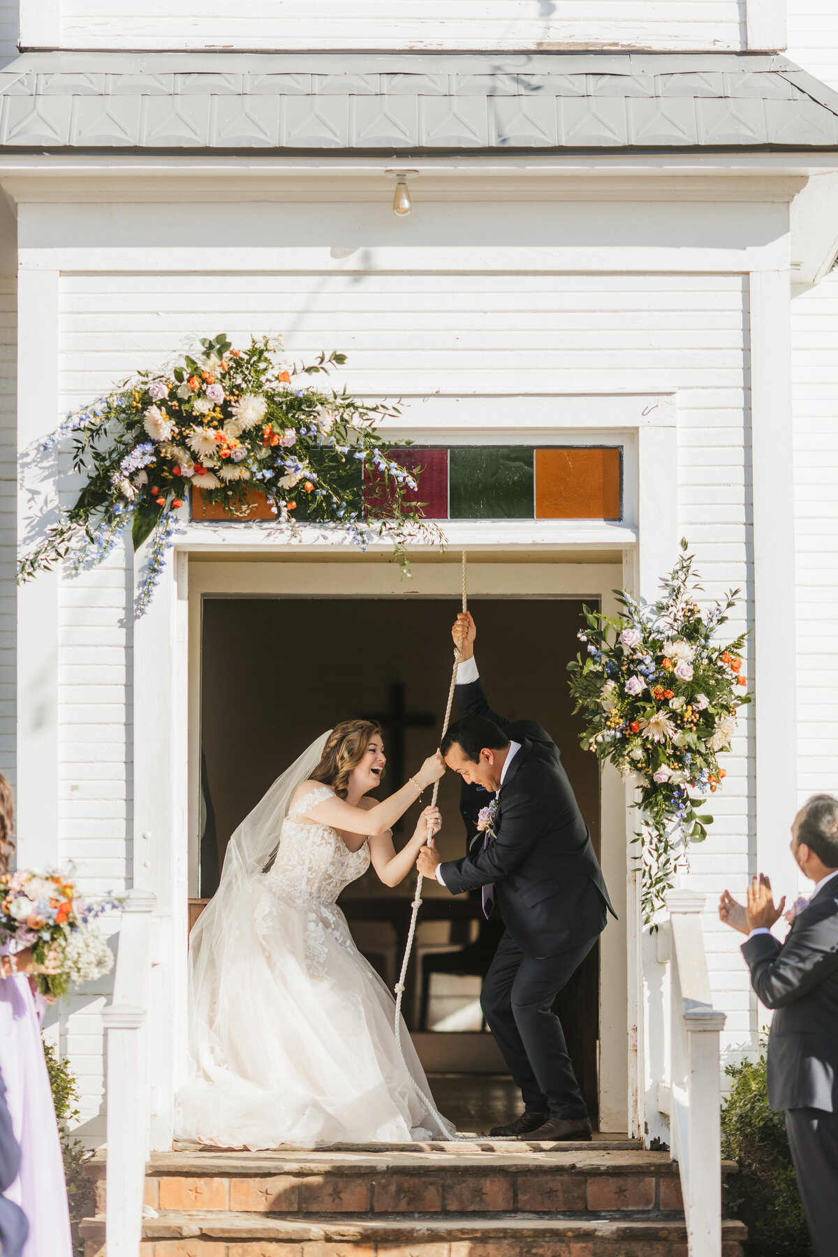 bride-and-groom-ringing-bell