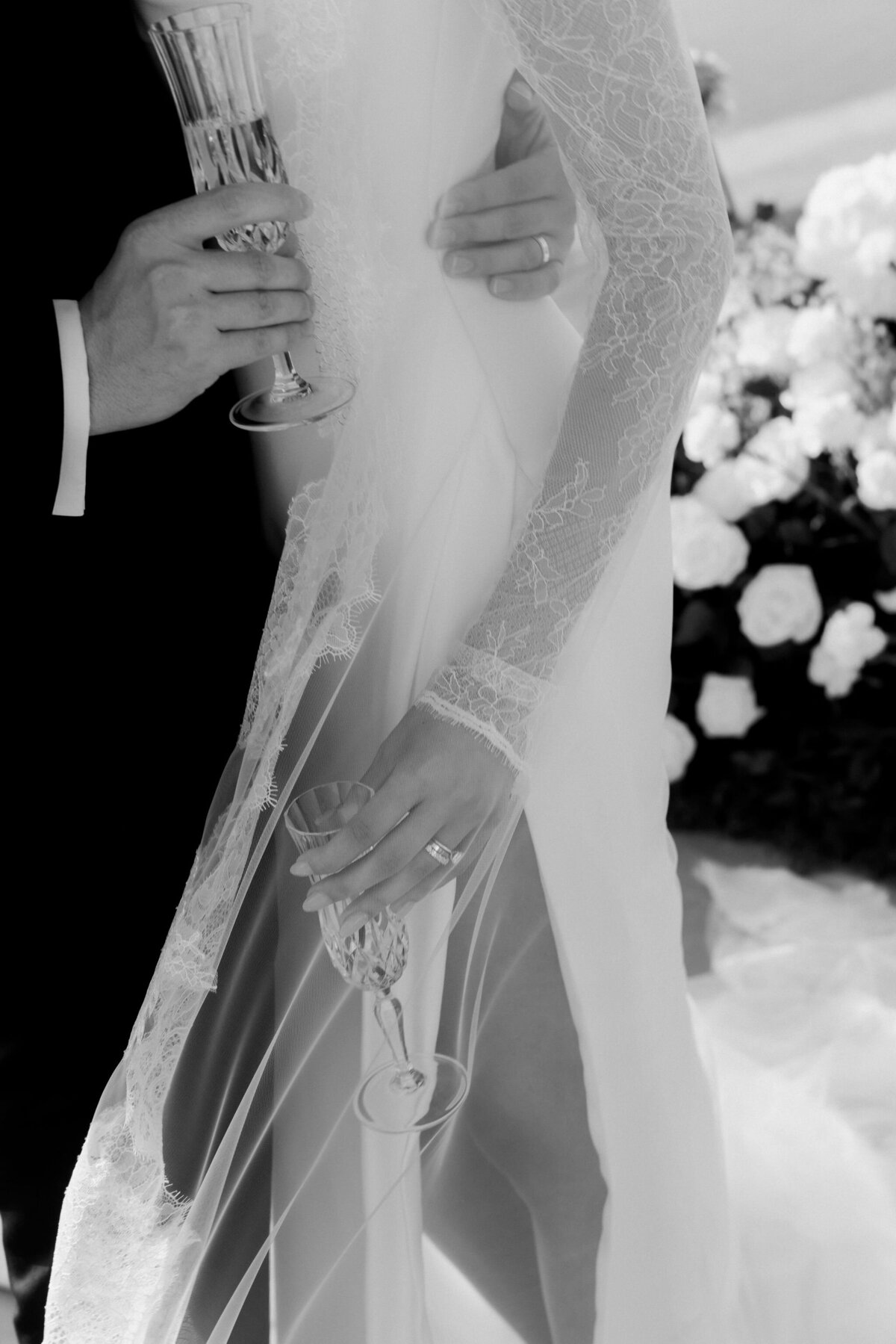 black and white of bride and groom details at wedding reception