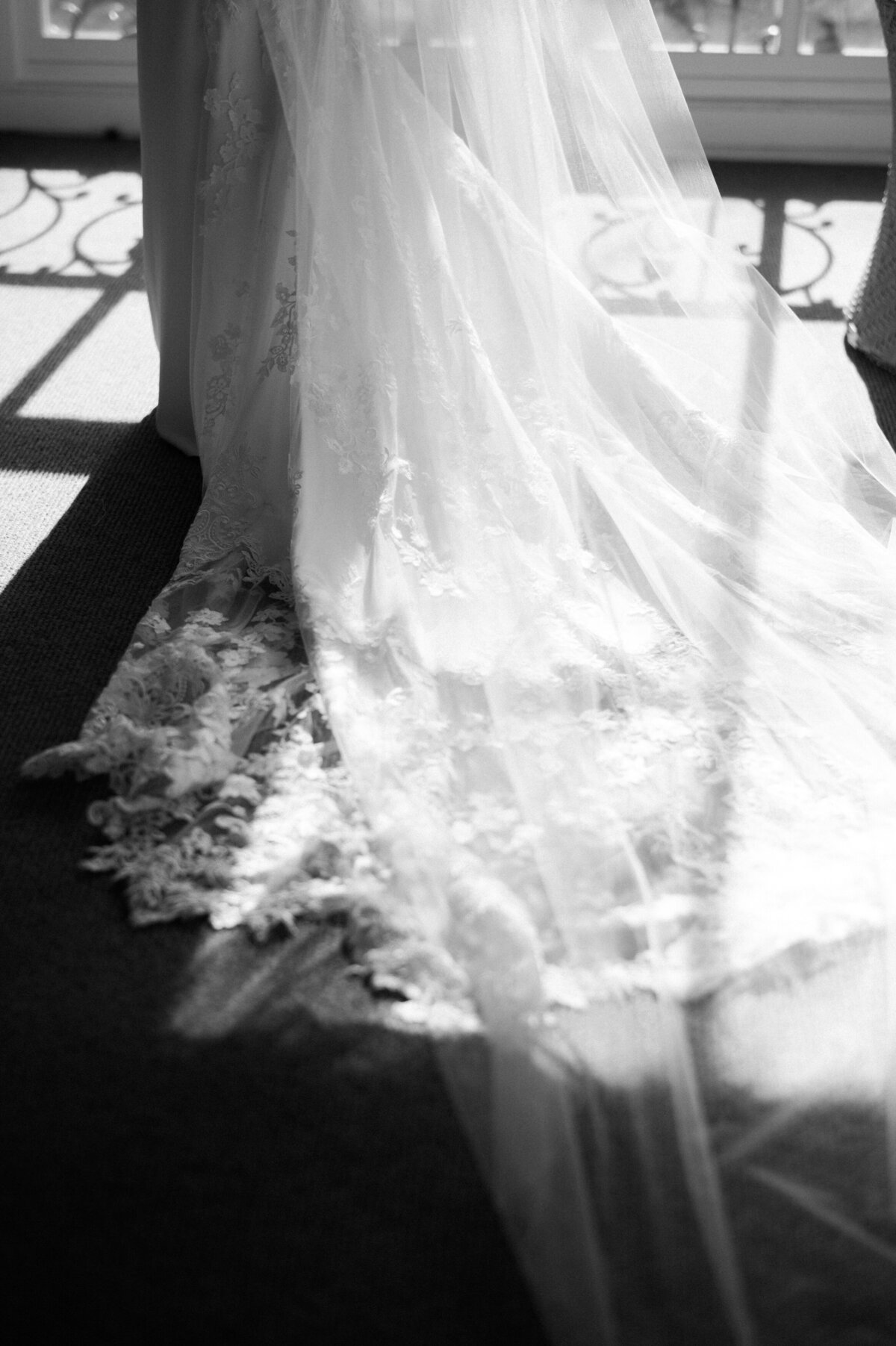 Lace veil draped in front of a sun lit window