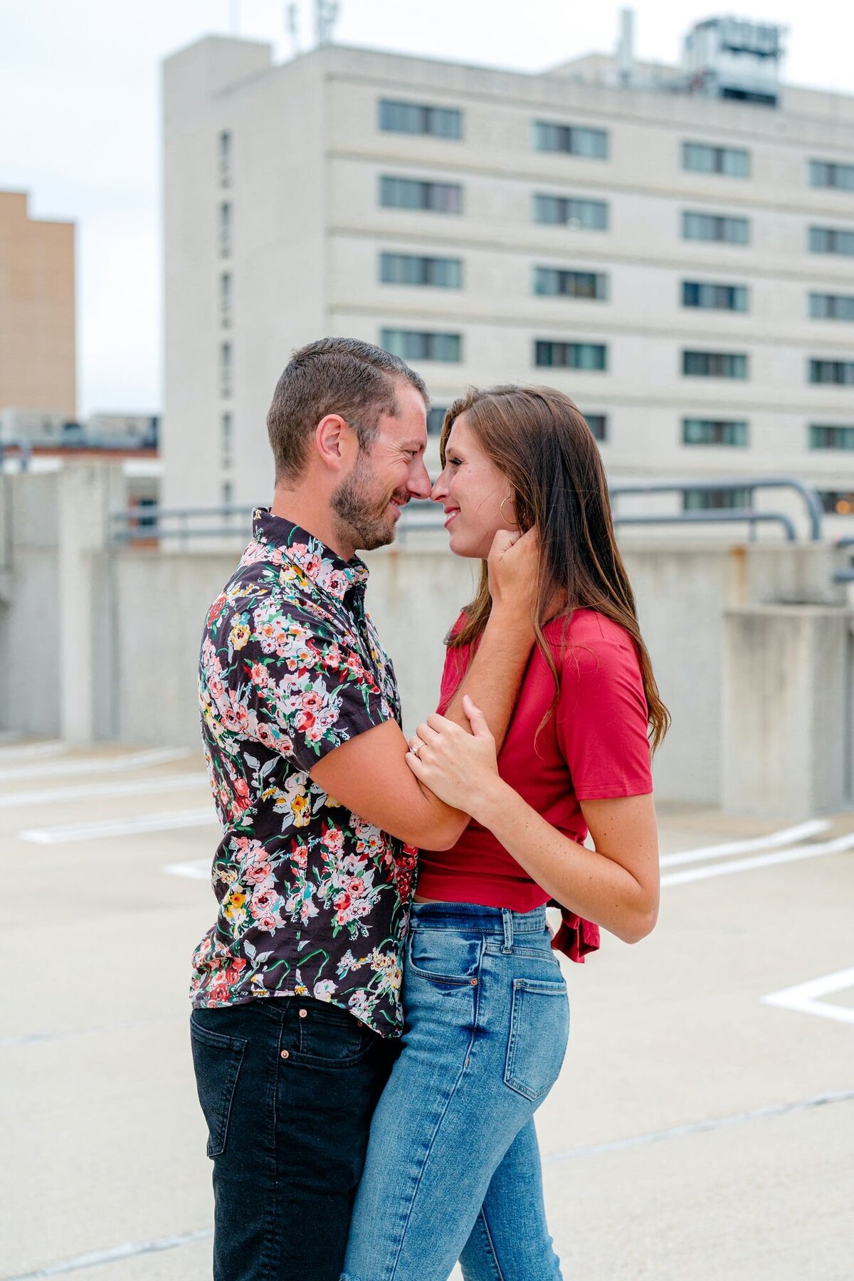 couple-back-view-holding-hands-rooftop-engagement