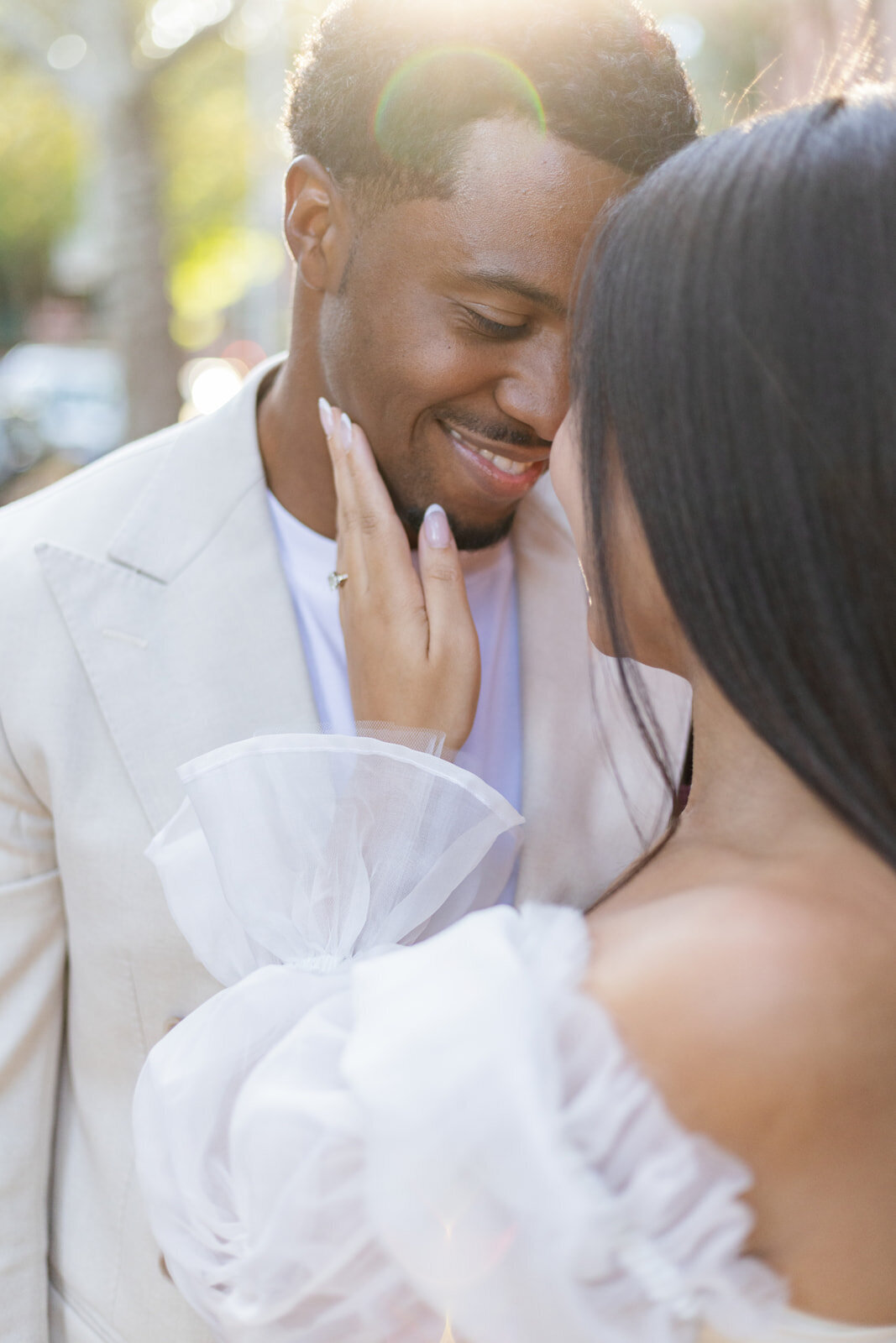 black couple touching foreheads and smiling
