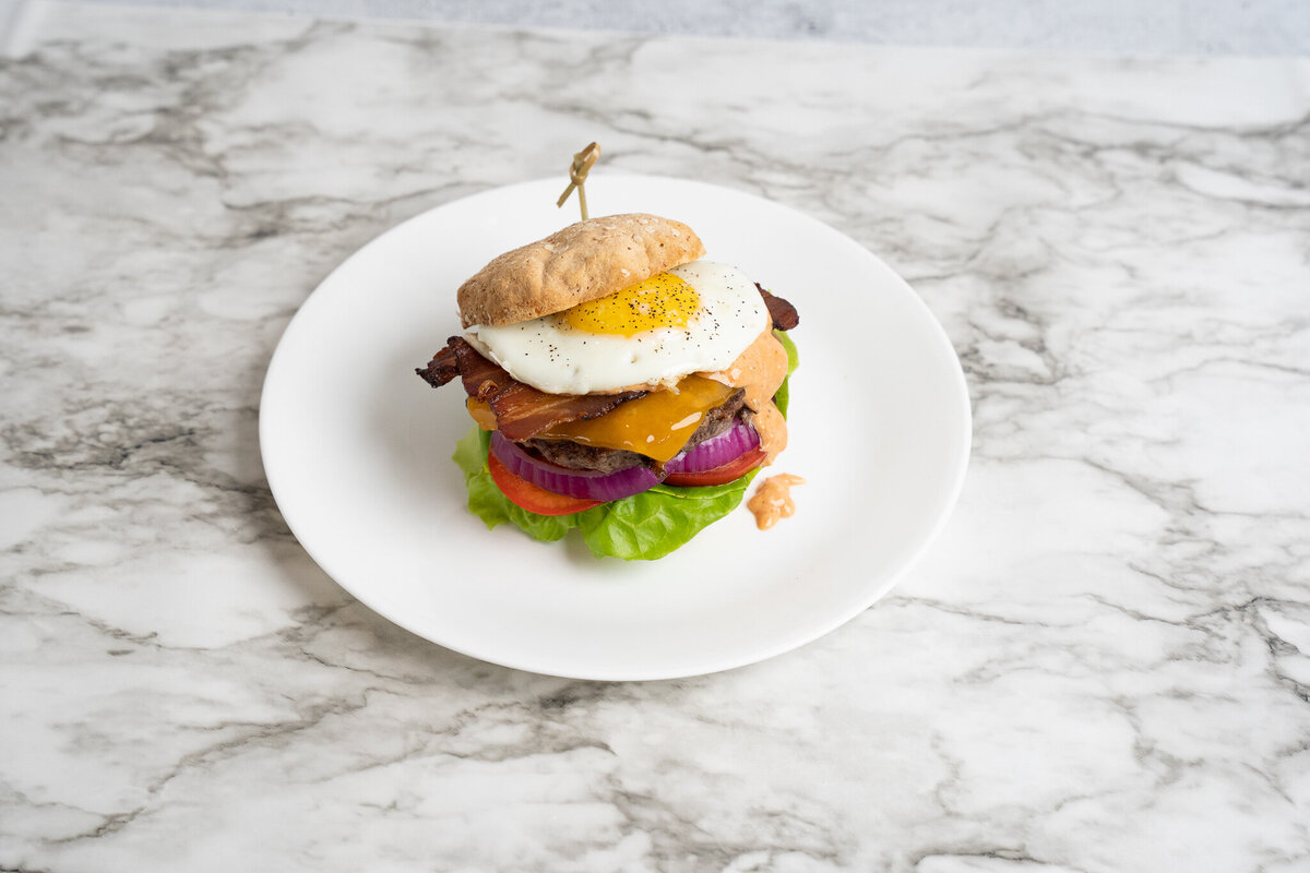 A plated hamburger at Mason Dixon Bakery & Bistro