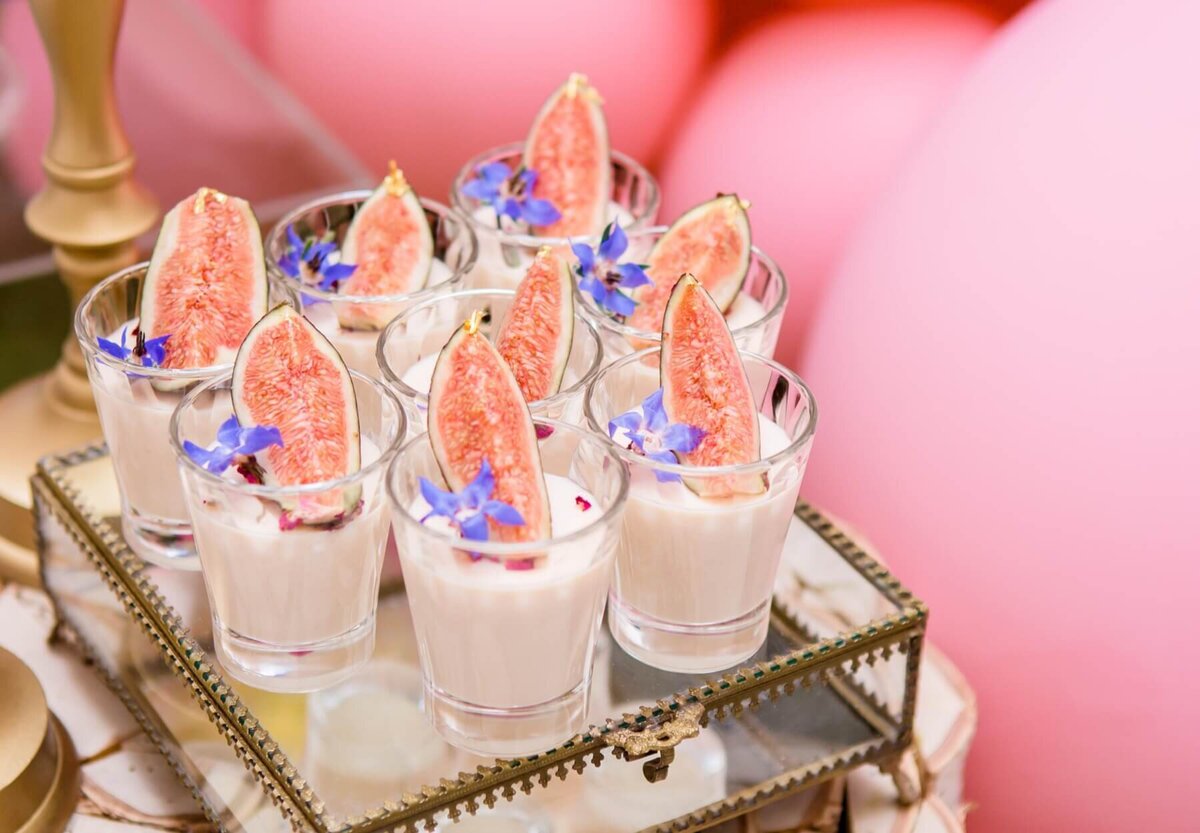 Pretty fruit desserts sat on a vintage glass box