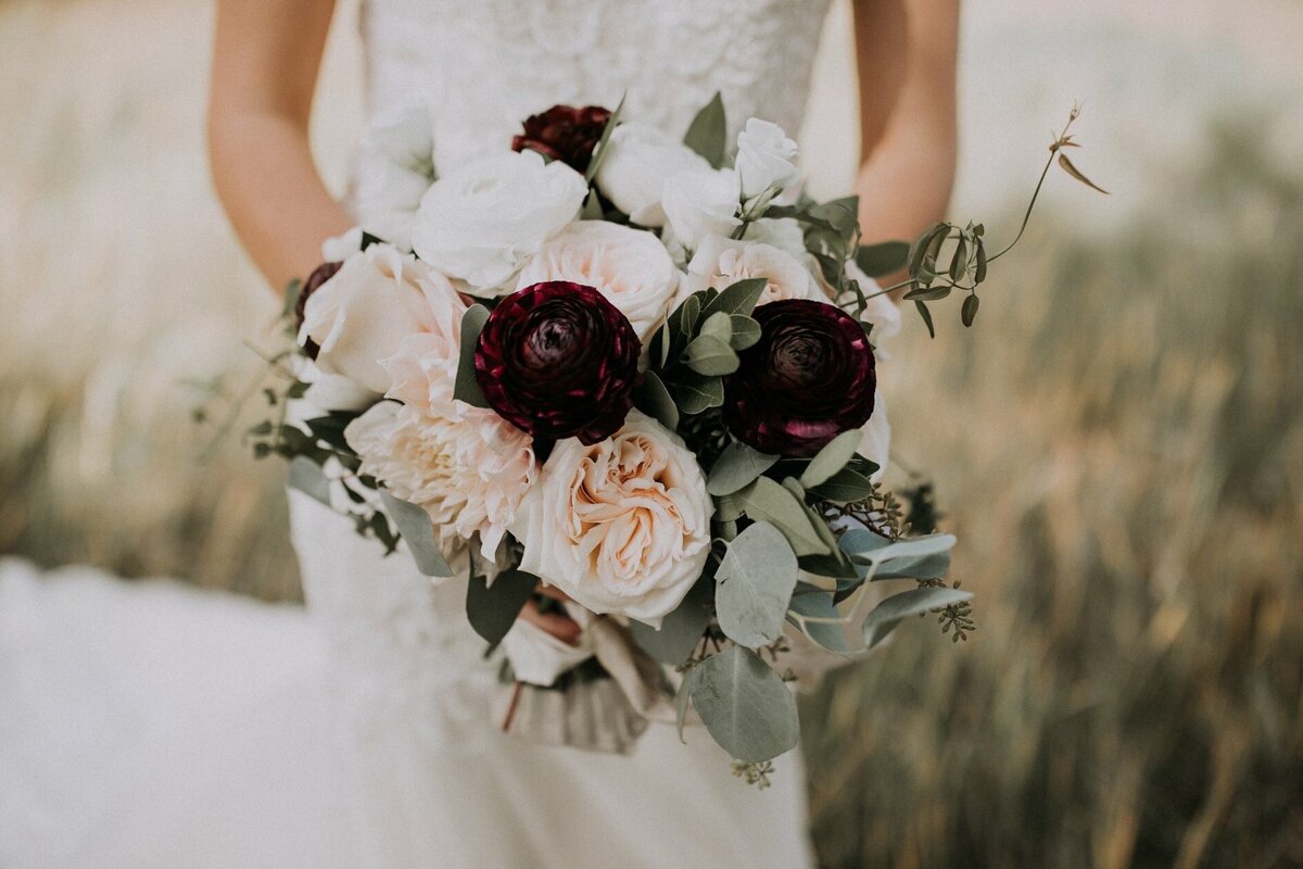 Classic bridal bouquets with pink, white, and burgundy by Hen & Chicks, classic Calgary, Alberta wedding florist, featured on the Brontë Bride Vendor Guide.