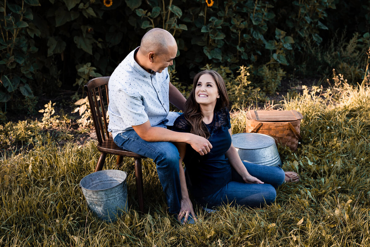 Parents in apple orchard in Toronto for family photograper