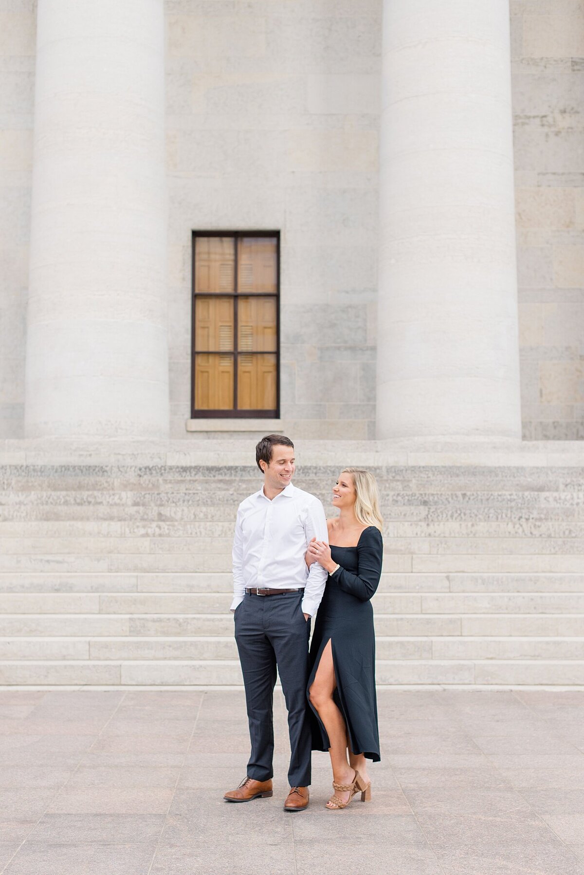 Bride smiling at groom in front of Ohio State House taken by Ohio Wedding Photographer