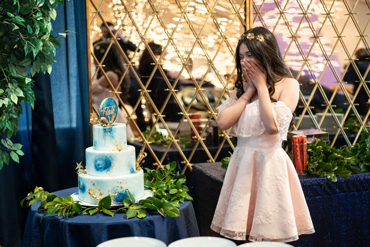 girl looking at her cake