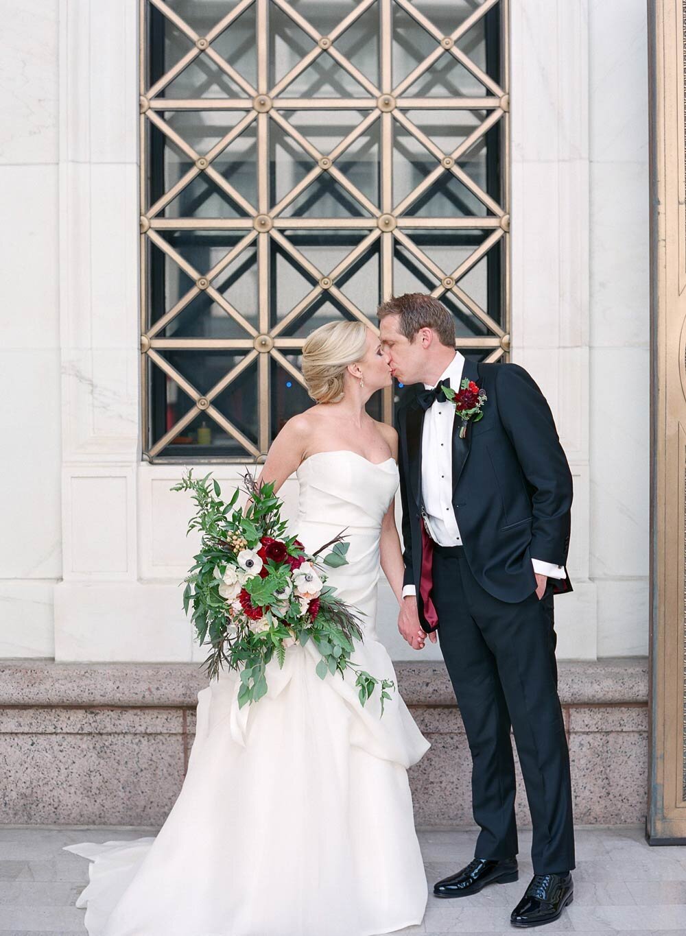 Bride and groom sharing a kiss at a black tie wedding in Denver, Colorado