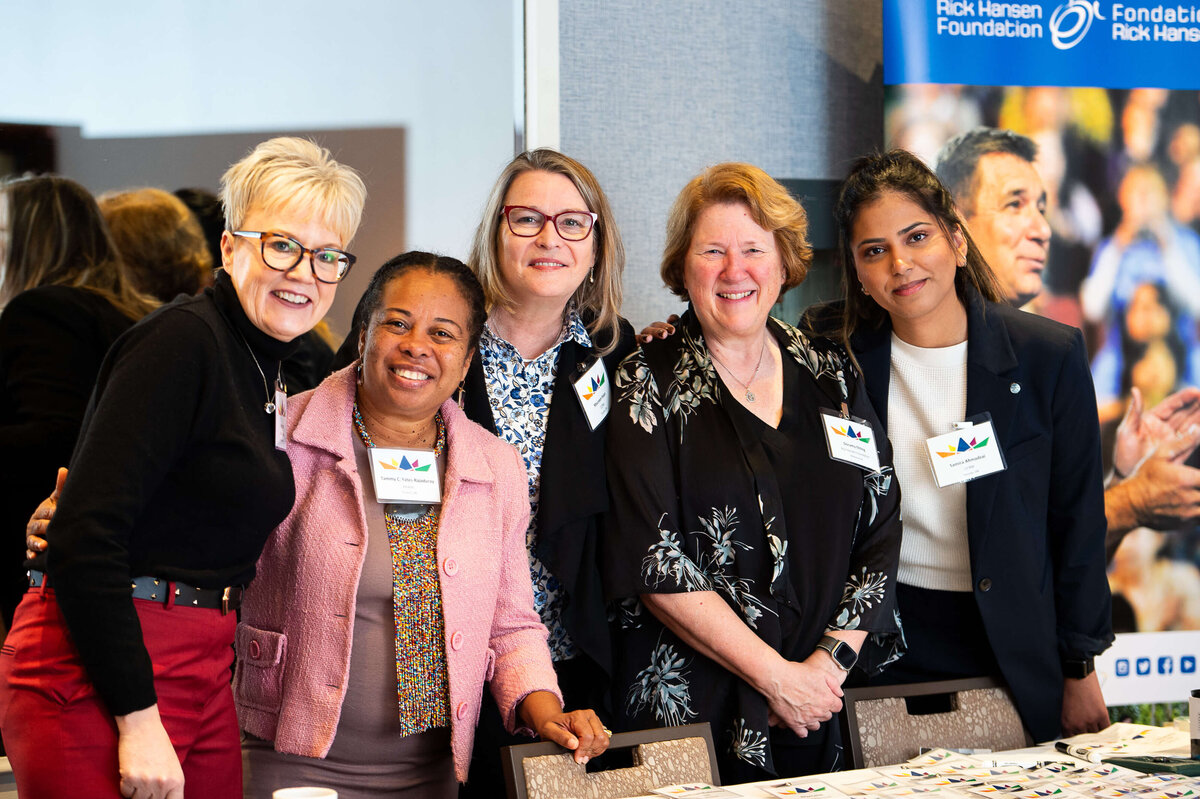 a photo showing the registration team of a corporate 2-day conference. Captured by Ottawa Event Photographer JEMMAN Photography COMMERCIAL