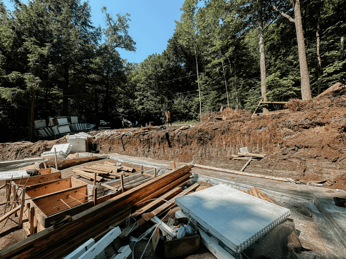 Custom home build in Haliburton Highlands featuring expert craftsmanship and premium natural materials in a forested setting.