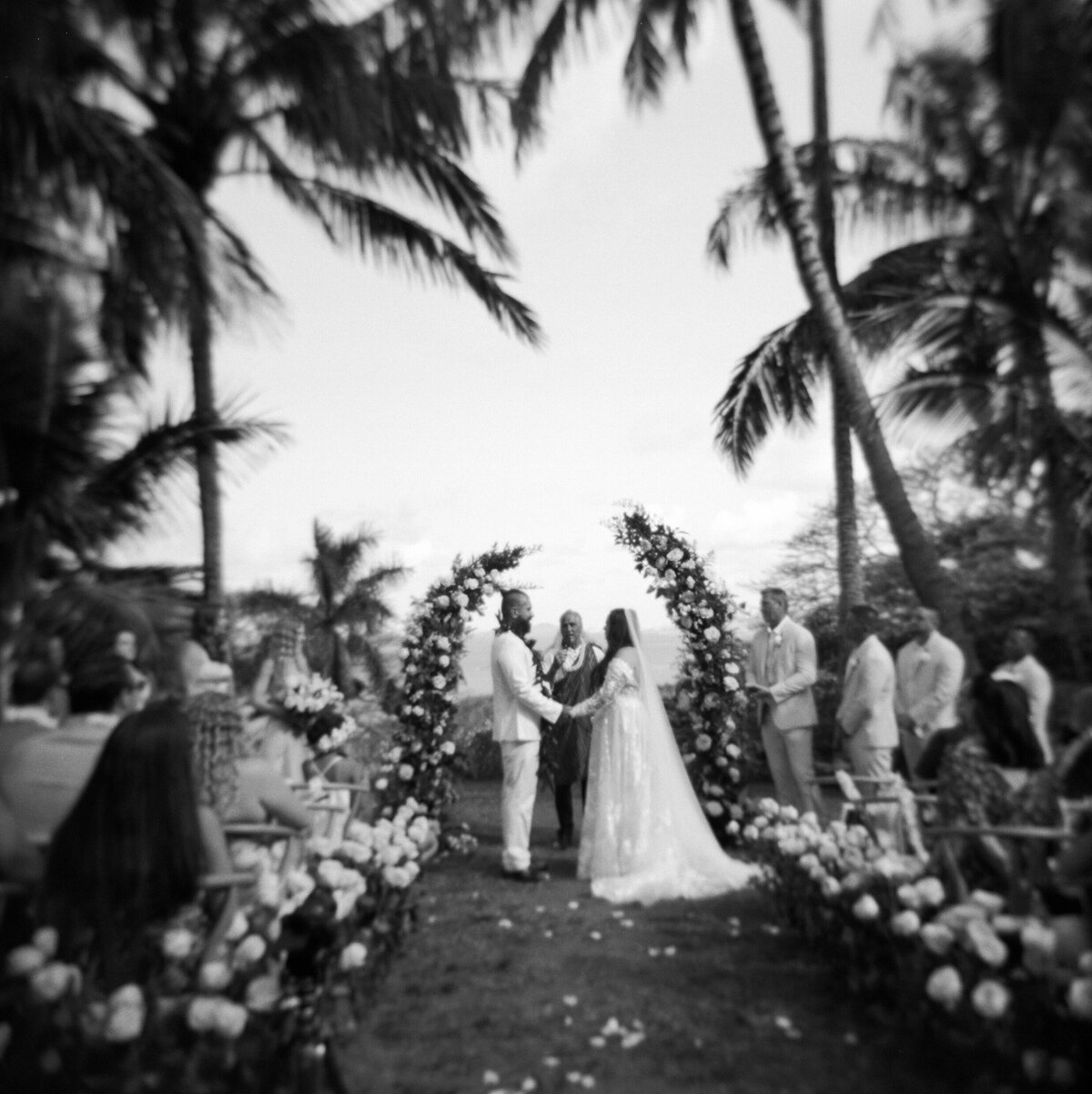 Luxury otdoor wedding ceremony at Paliku Gardens, highlighting the natural beauty of the location captured by Kate Winters Photography