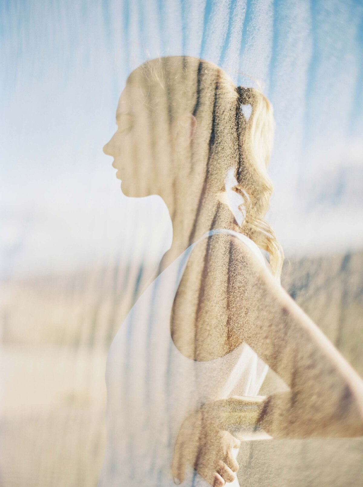 double exposure of bride with sand from sand dunes in desert