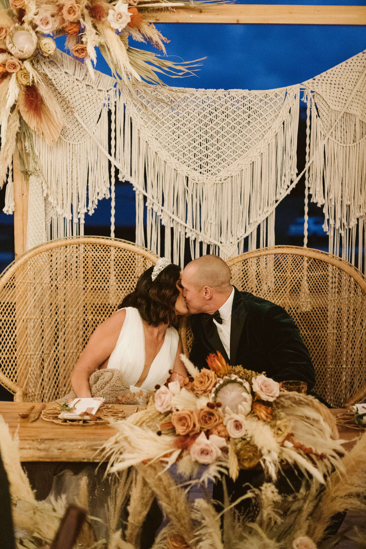 Newlyweds Kissing Wedding Reception