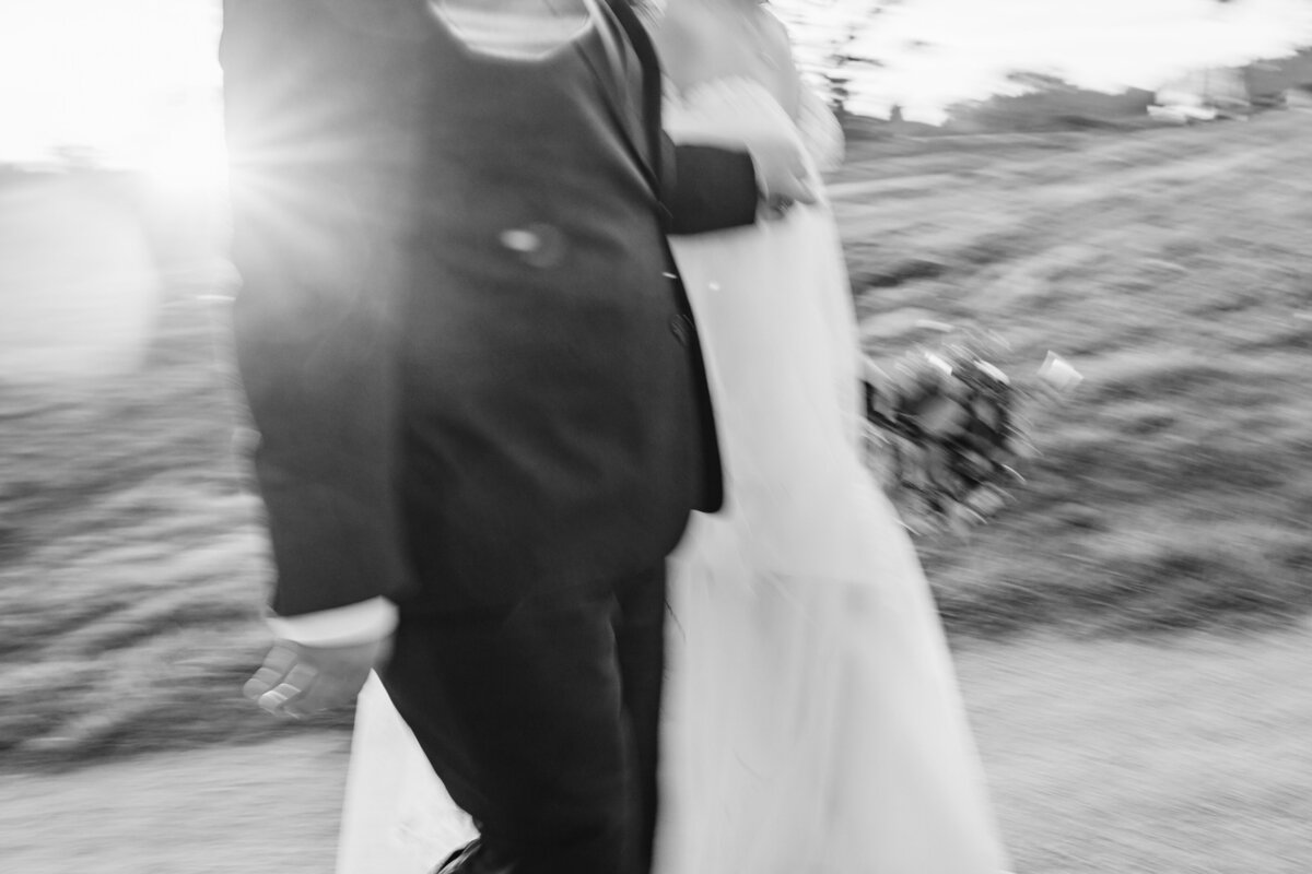 bride and groom walking outside