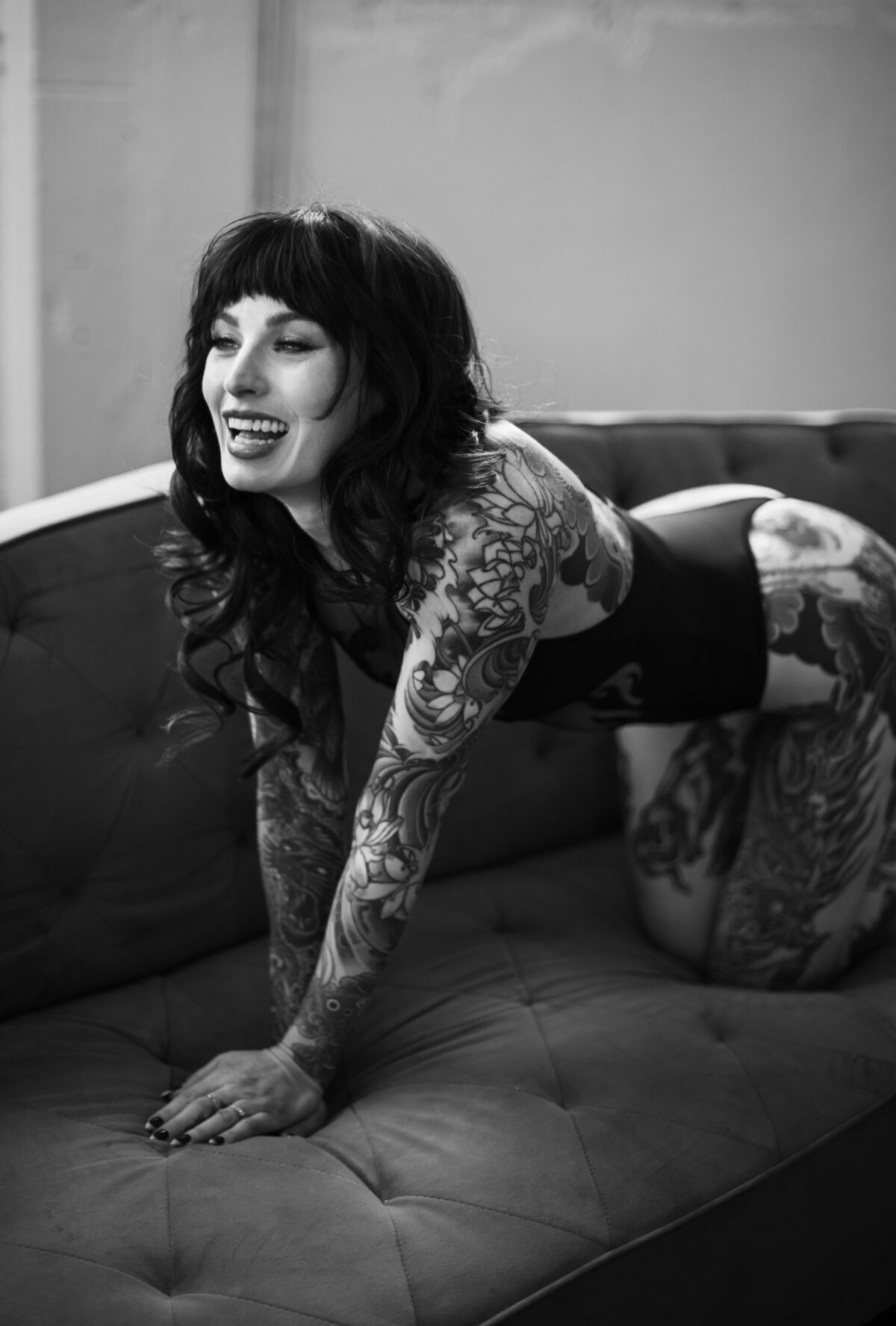 Empowering boudoir session showcasing bold styling and confident expressions.
