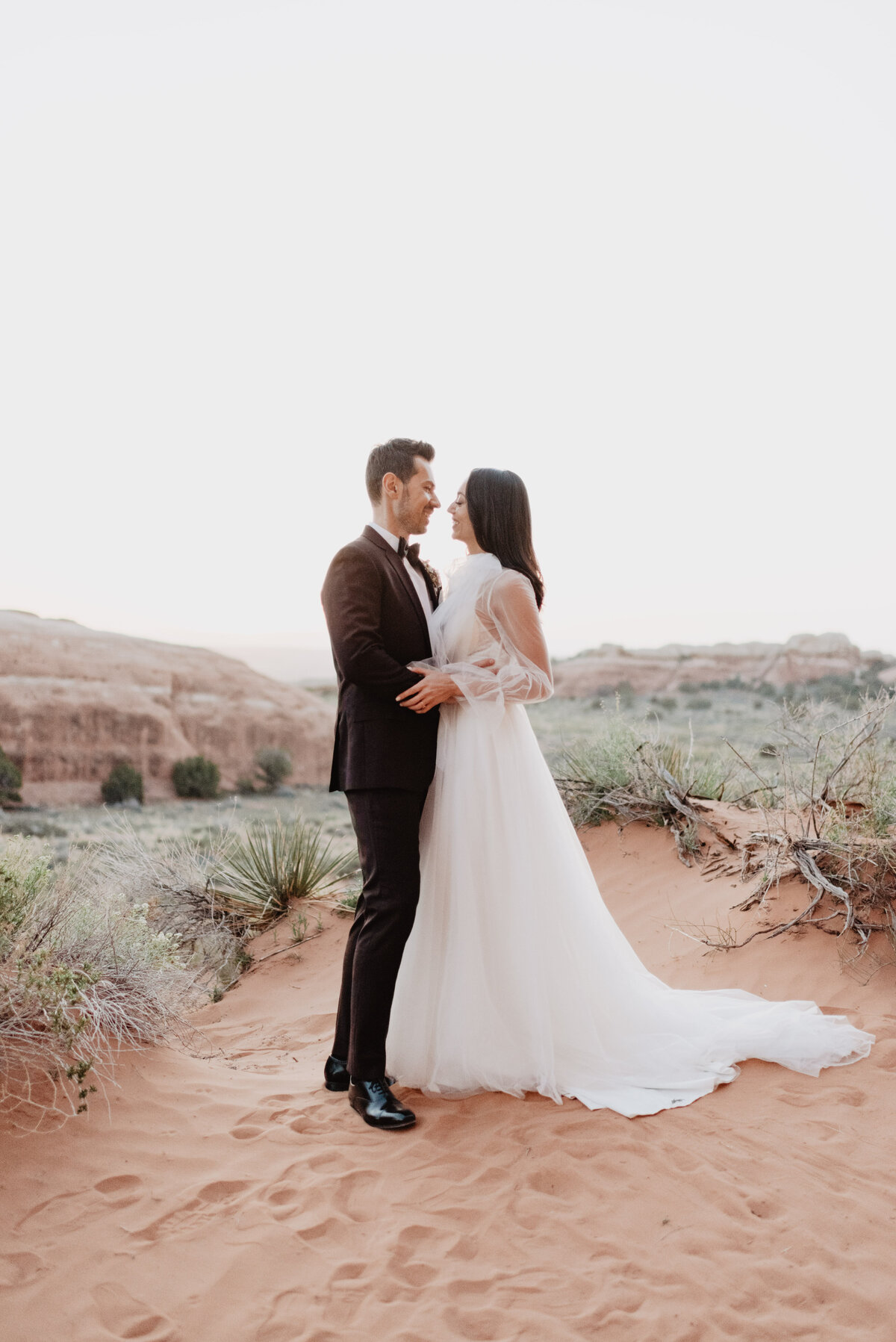 Utah elopement photographer captures couple embracing after intimate wedding ceremony