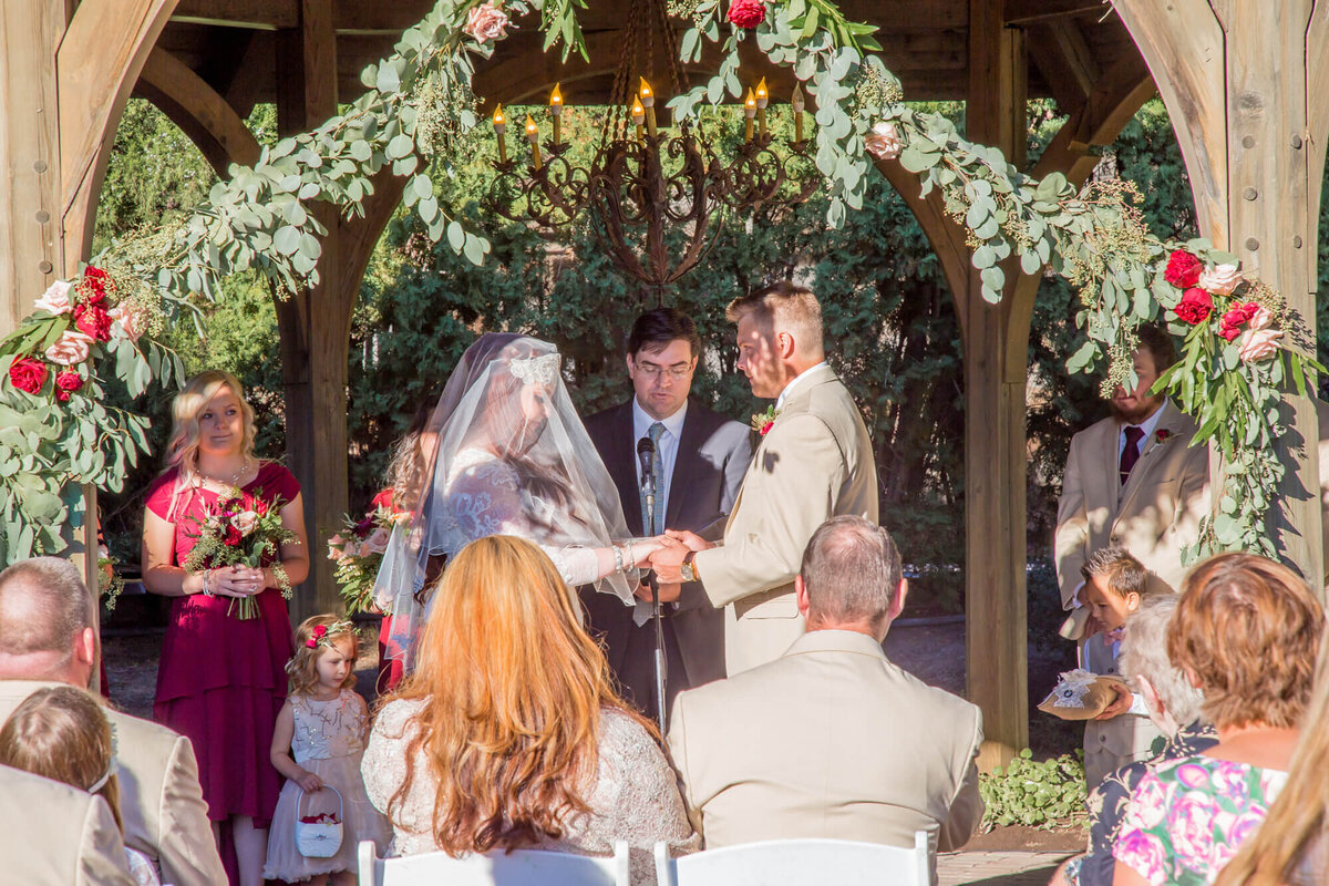 Garden wedding ceremony vows at Thanksgiving Point