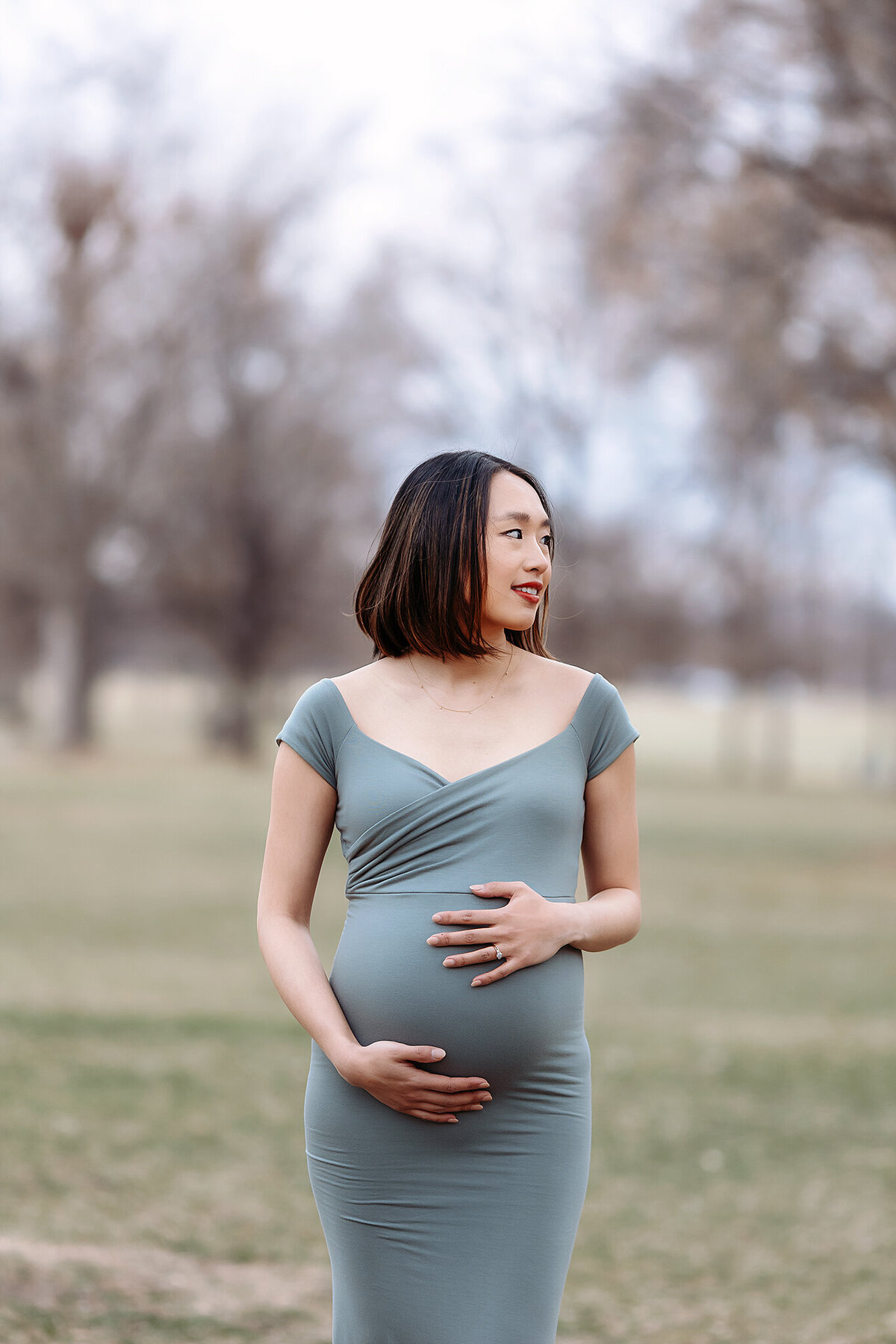 beautiful mama to be in denver colorado posing for her maternity photos