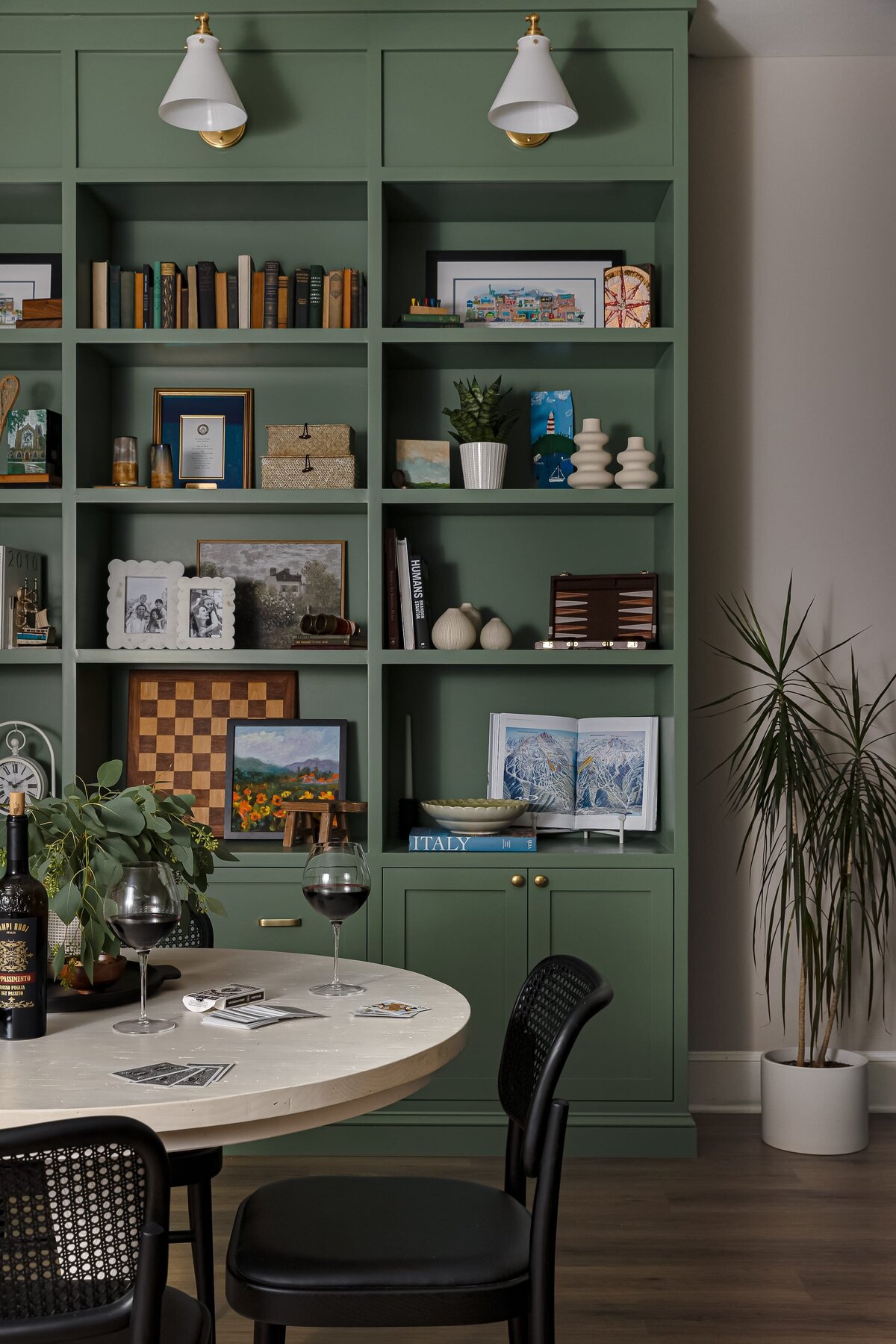 melinda chesson interiors meadowood place green styled bookshelf with wood floors