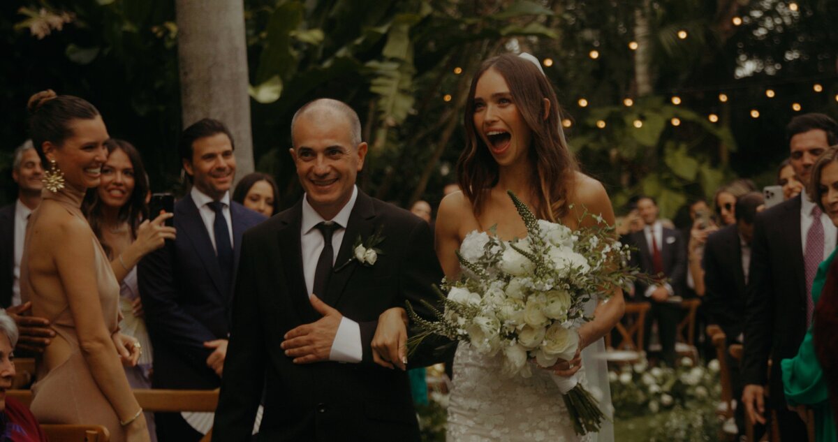 father walks bride down aisle