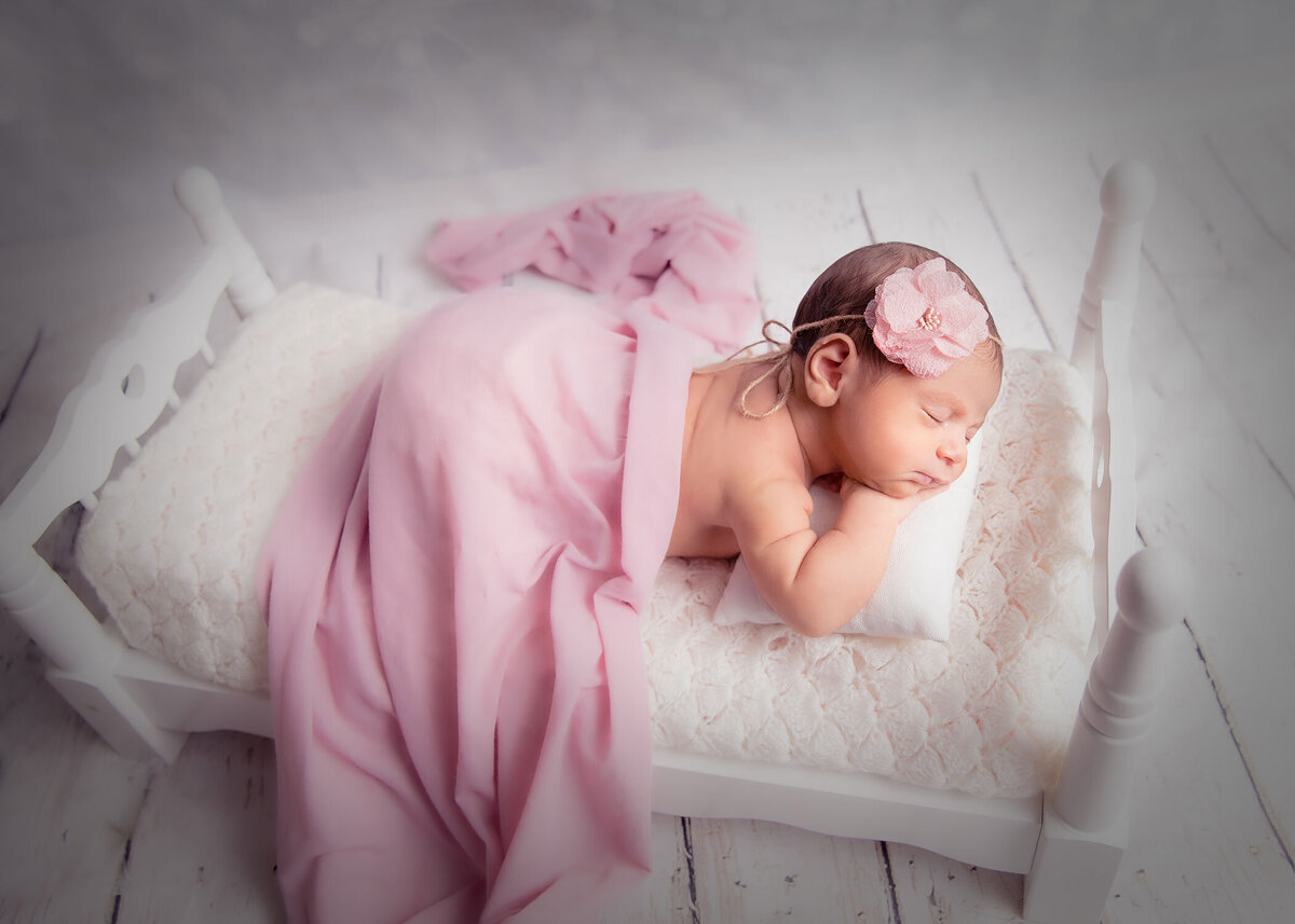 Tally Safdie photo newborn photography baby girl tiny bed white and pink