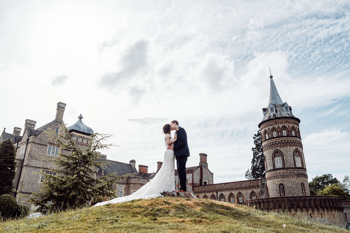 wedding-couple-kissing-horsley-towers-surrey