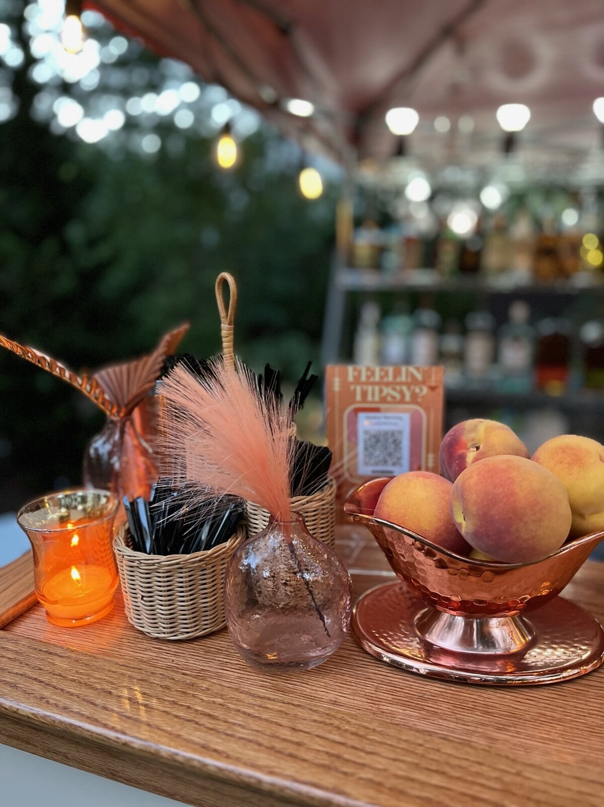 Bar decor and fruit sitting on bar top with candle
