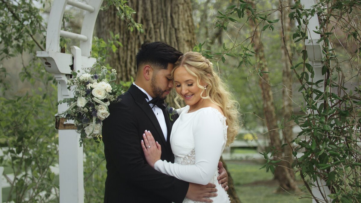 A wedding couple posing at the altar of their Lehigh Valley wedding.