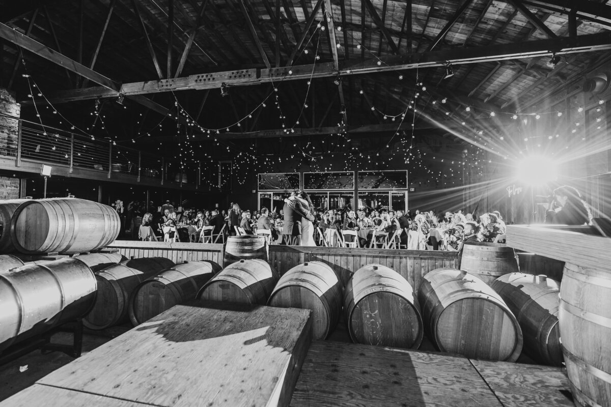 first-dance-saltwater-wedding-couple-ct-dj-industrial-wine-barrels