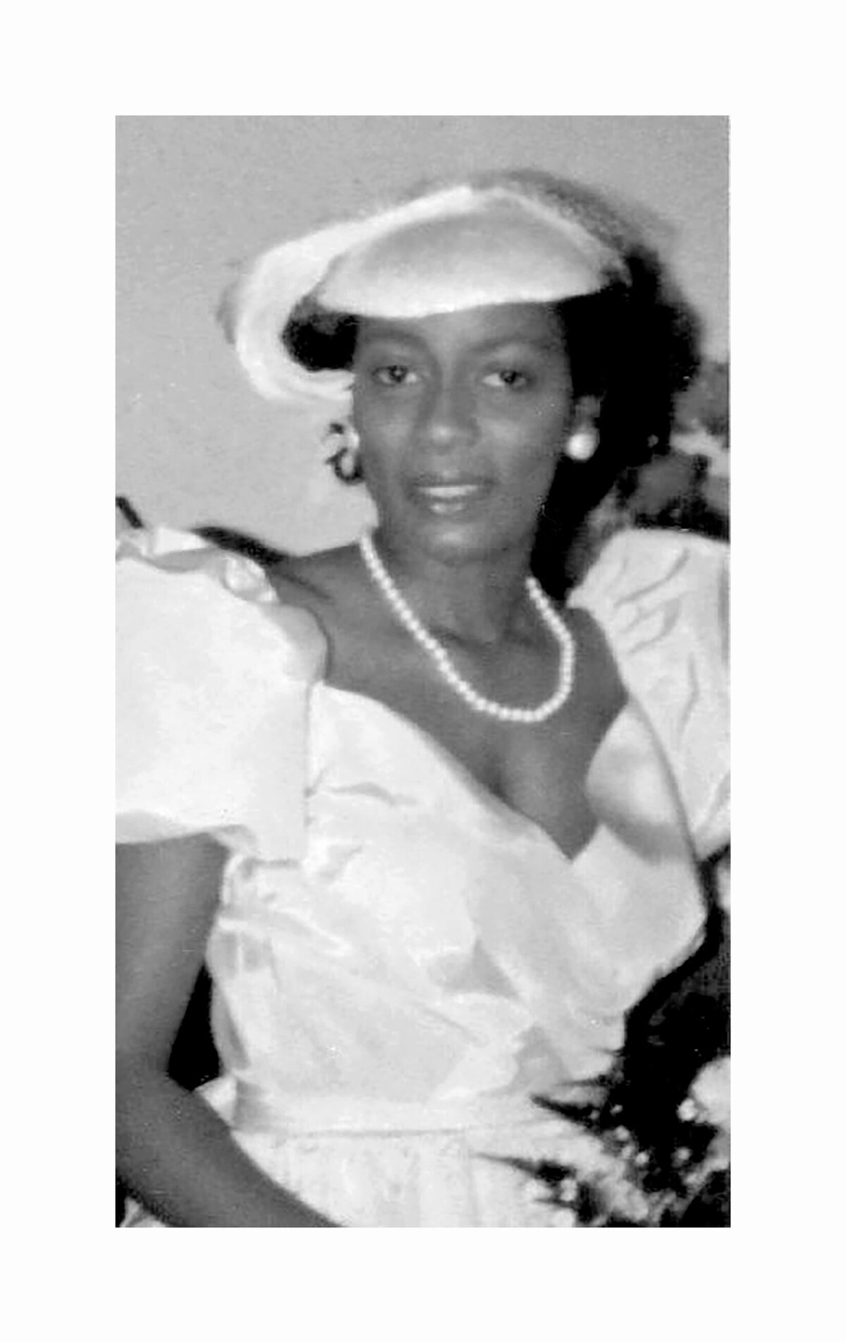 beautiful classic black family wedding in 1980.  Timeless woman in pearls and hat.