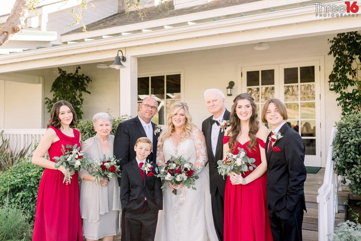 Bride and Groom pose for photos with family members