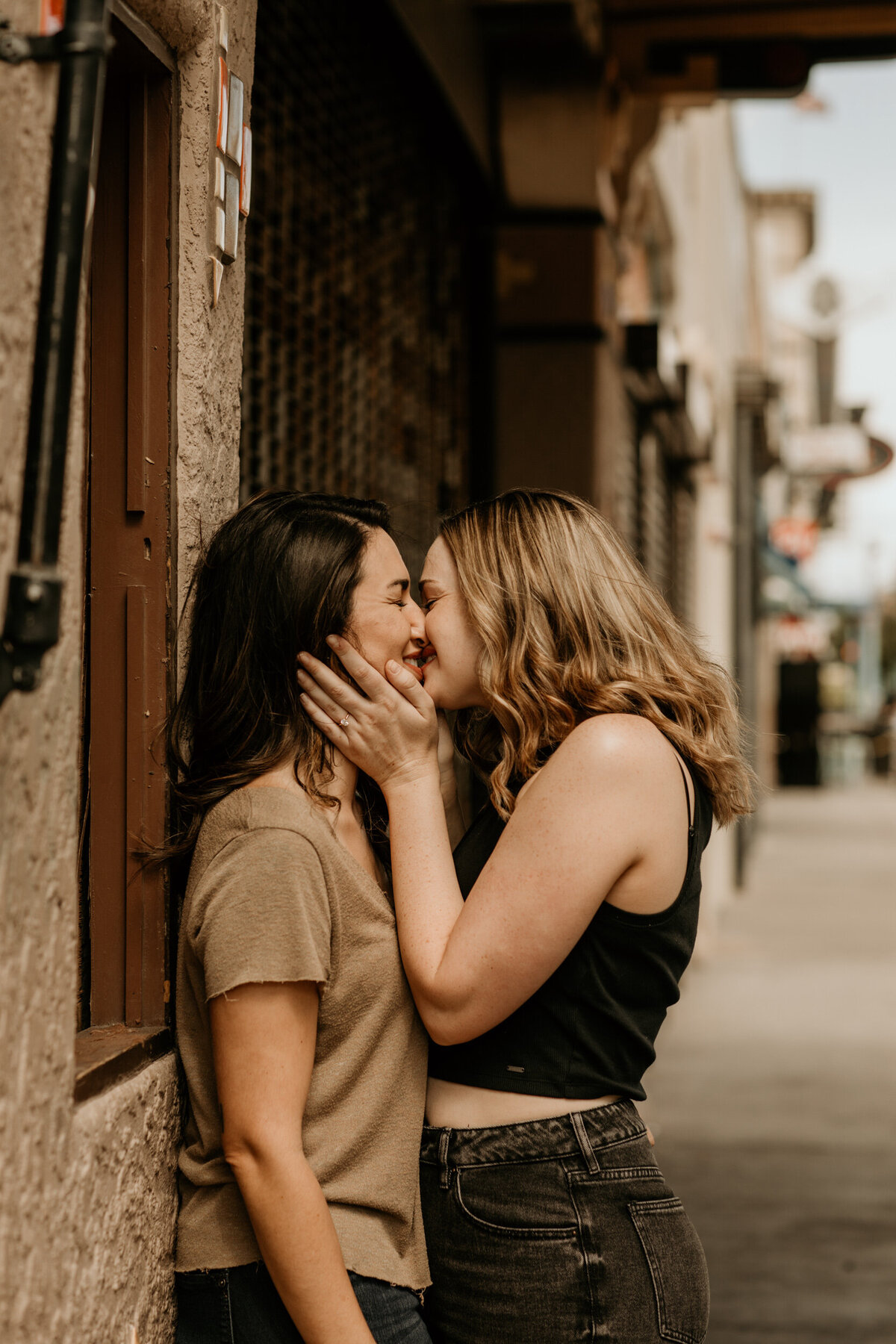 same sex couple kissing in downtown Albuquerque