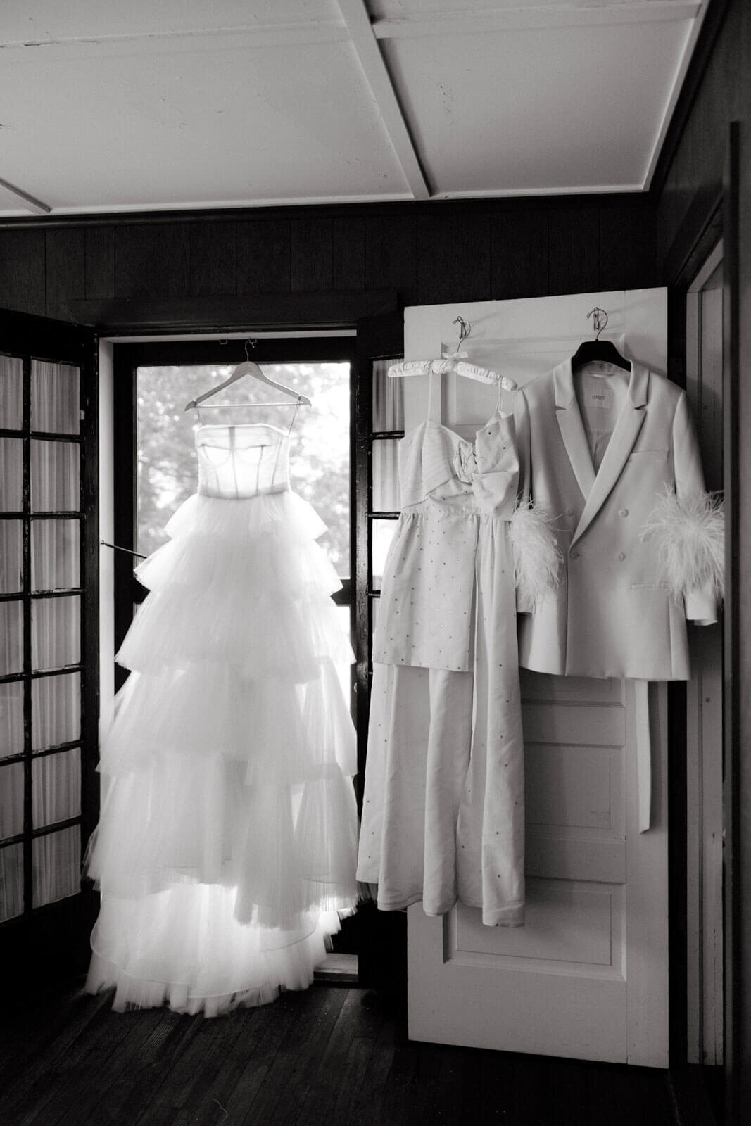 The bride's two wedding dresses are hung in a room at The Ausable Club, New York.