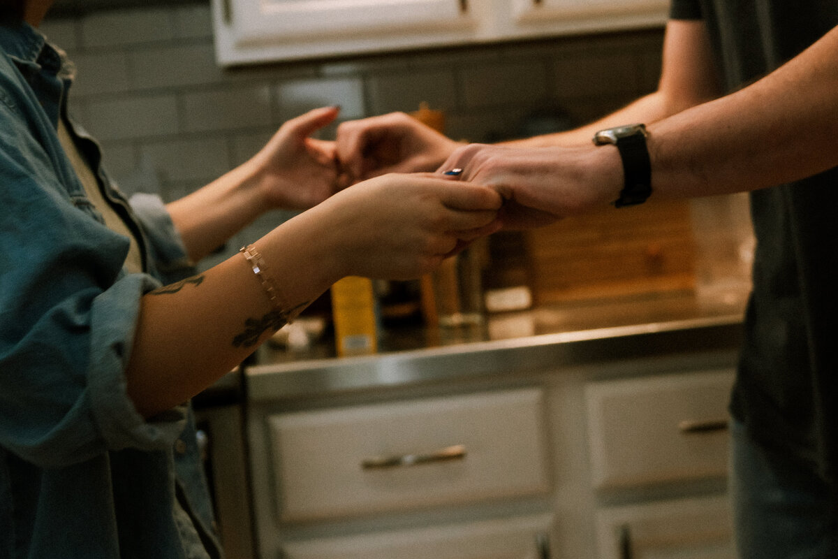 close up of couple holding hands