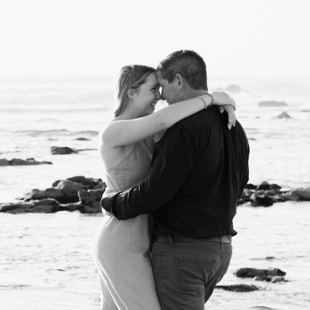 Couple in loving embrace on beach