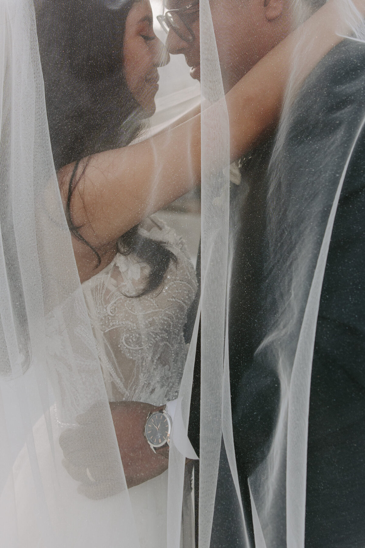 Close up of a couple hugging one another.