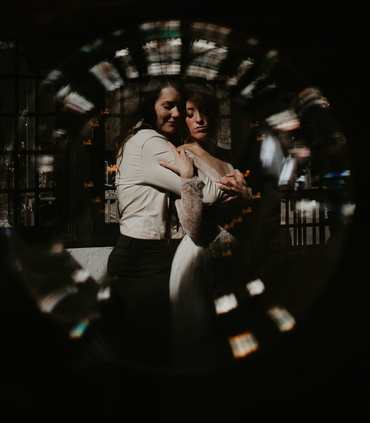 creative double exposure of lesbian couple in a crystal ball