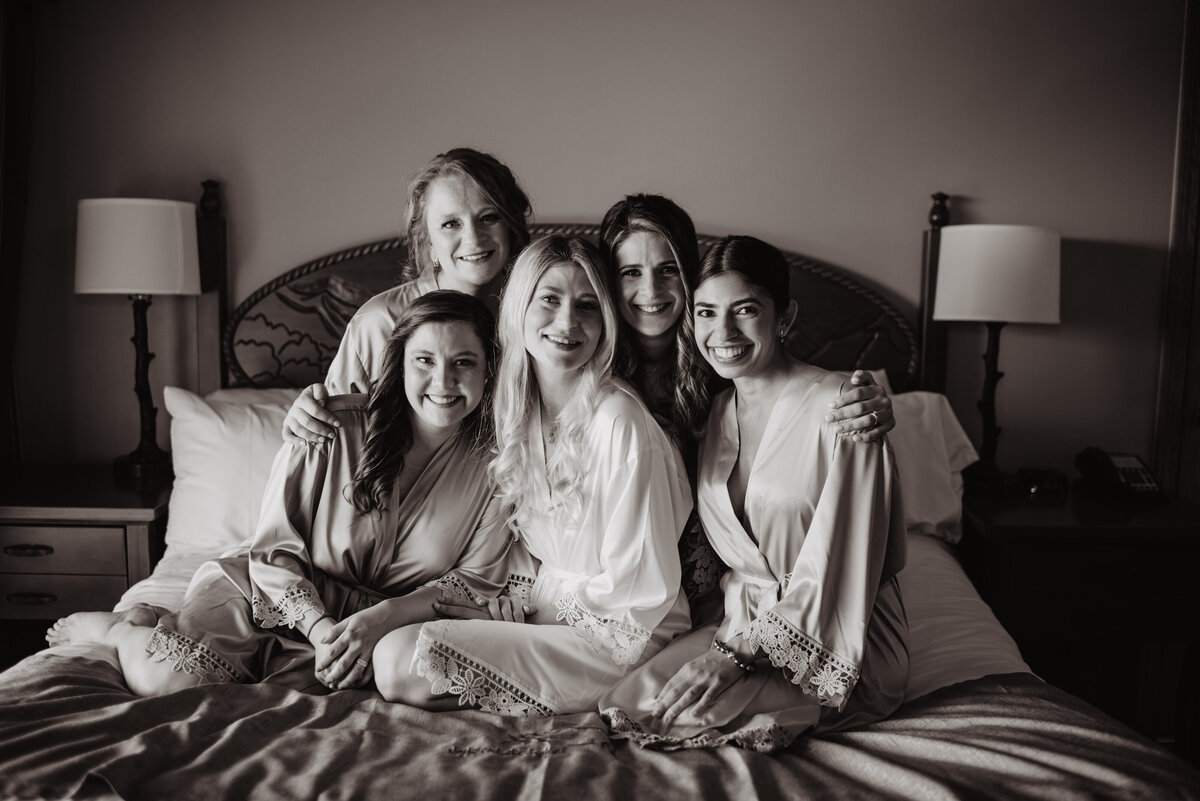 Photographers Jackson Hole capture black and white portrait of bridesmaids with bride